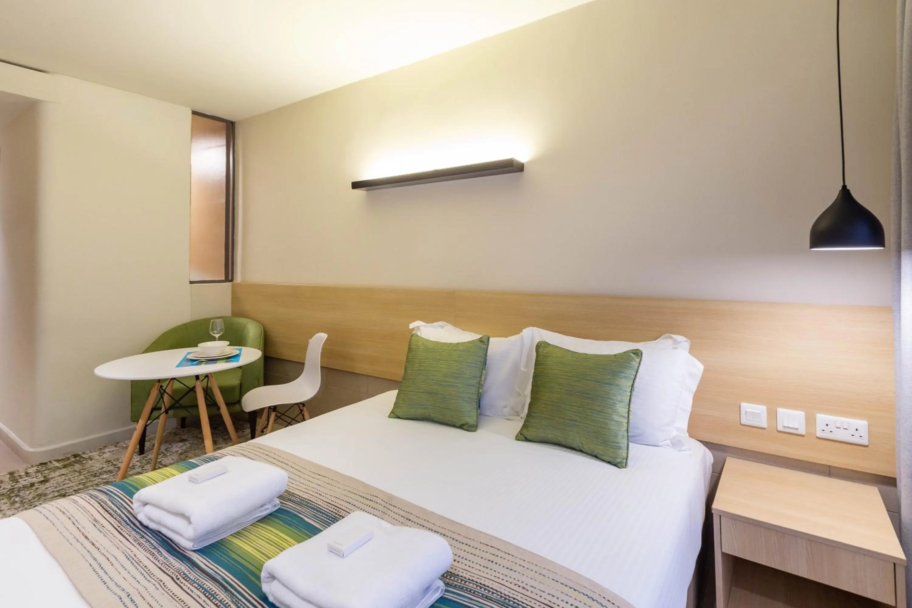 Photo of the whole room, Bed in Kozi Suites Nairobi Airport