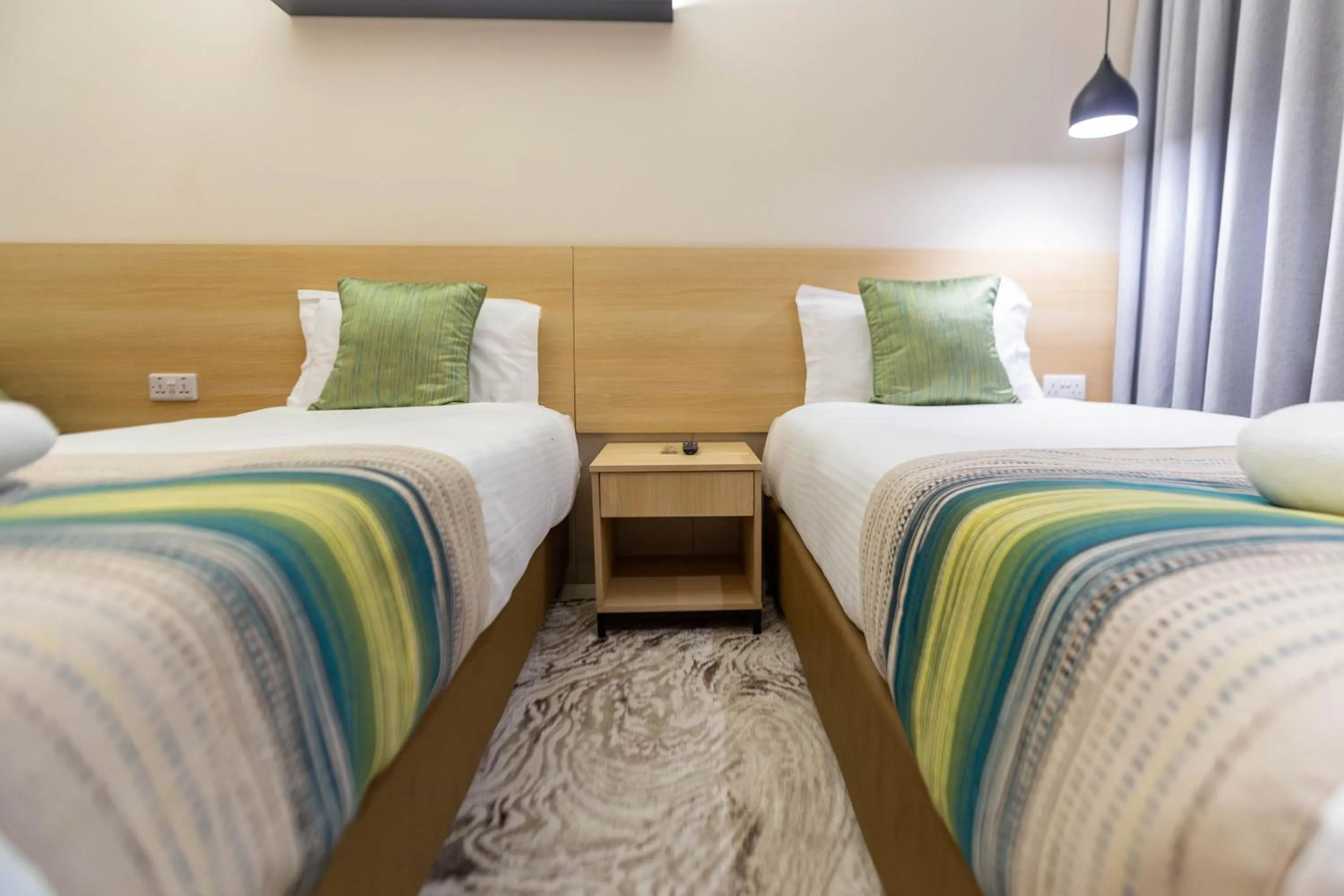 Photo of the whole room, Bed in Kozi Suites Nairobi Airport