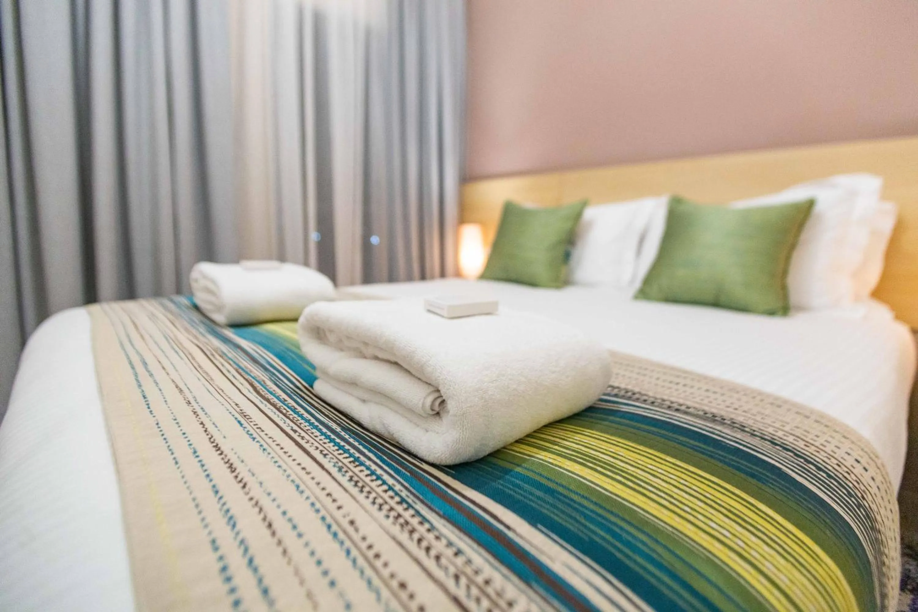 Photo of the whole room, Bed in Kozi Suites Nairobi Airport