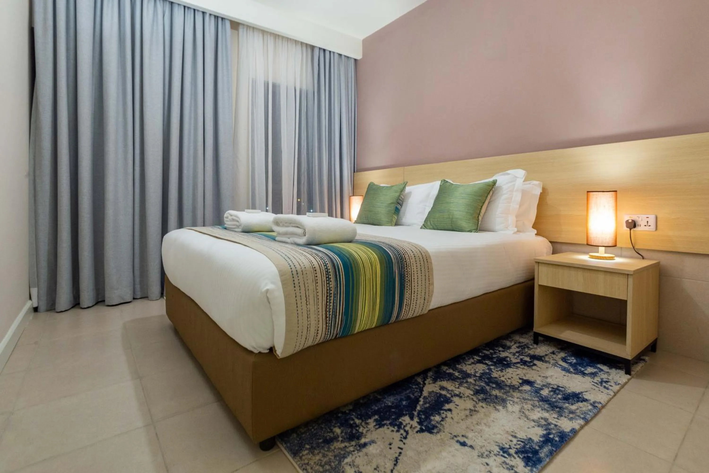Photo of the whole room, Bed in Kozi Suites Nairobi Airport