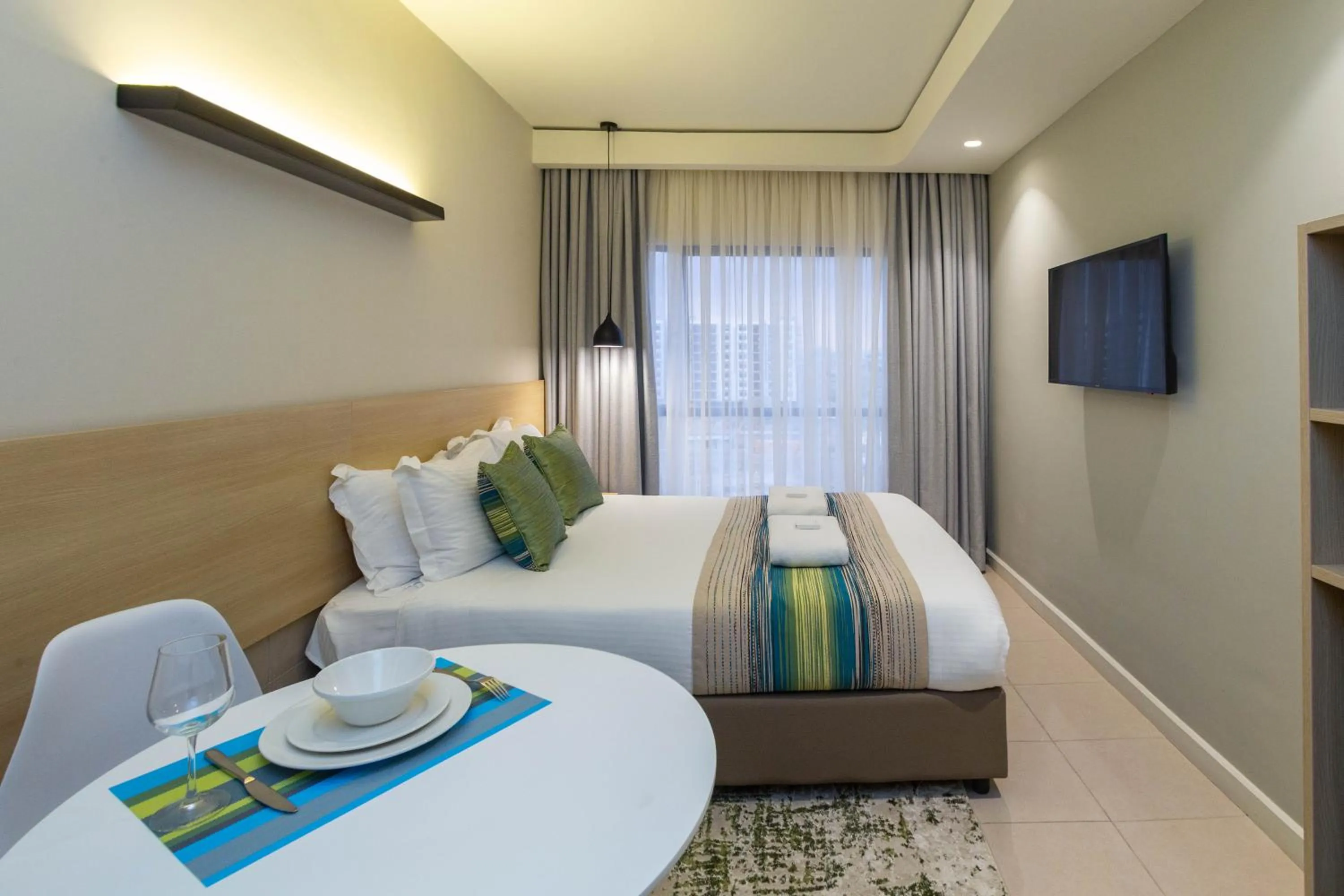 Photo of the whole room, Bed in Kozi Suites Nairobi Airport