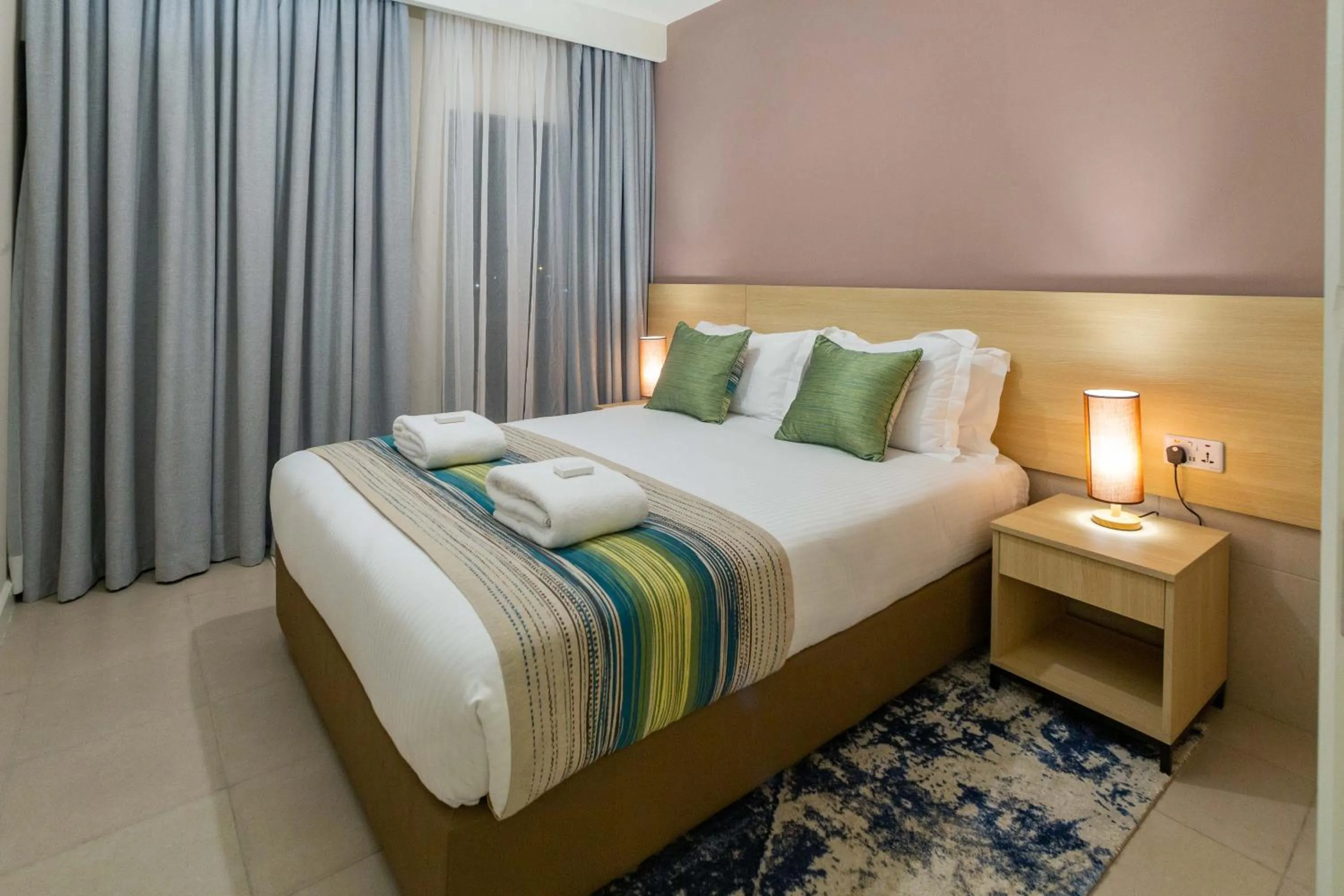 Photo of the whole room, Bed in Kozi Suites Nairobi Airport