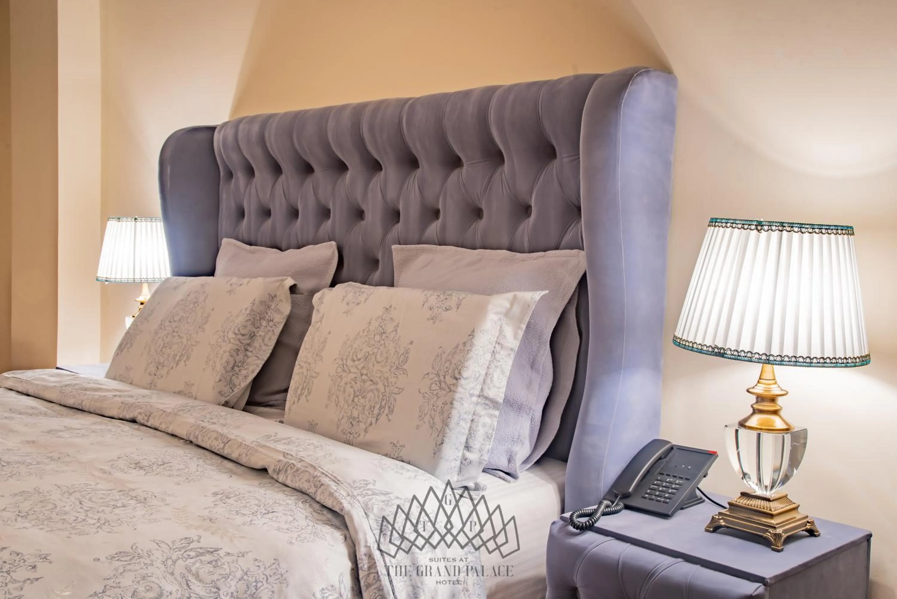 Bed in The Grand Palace Hotel