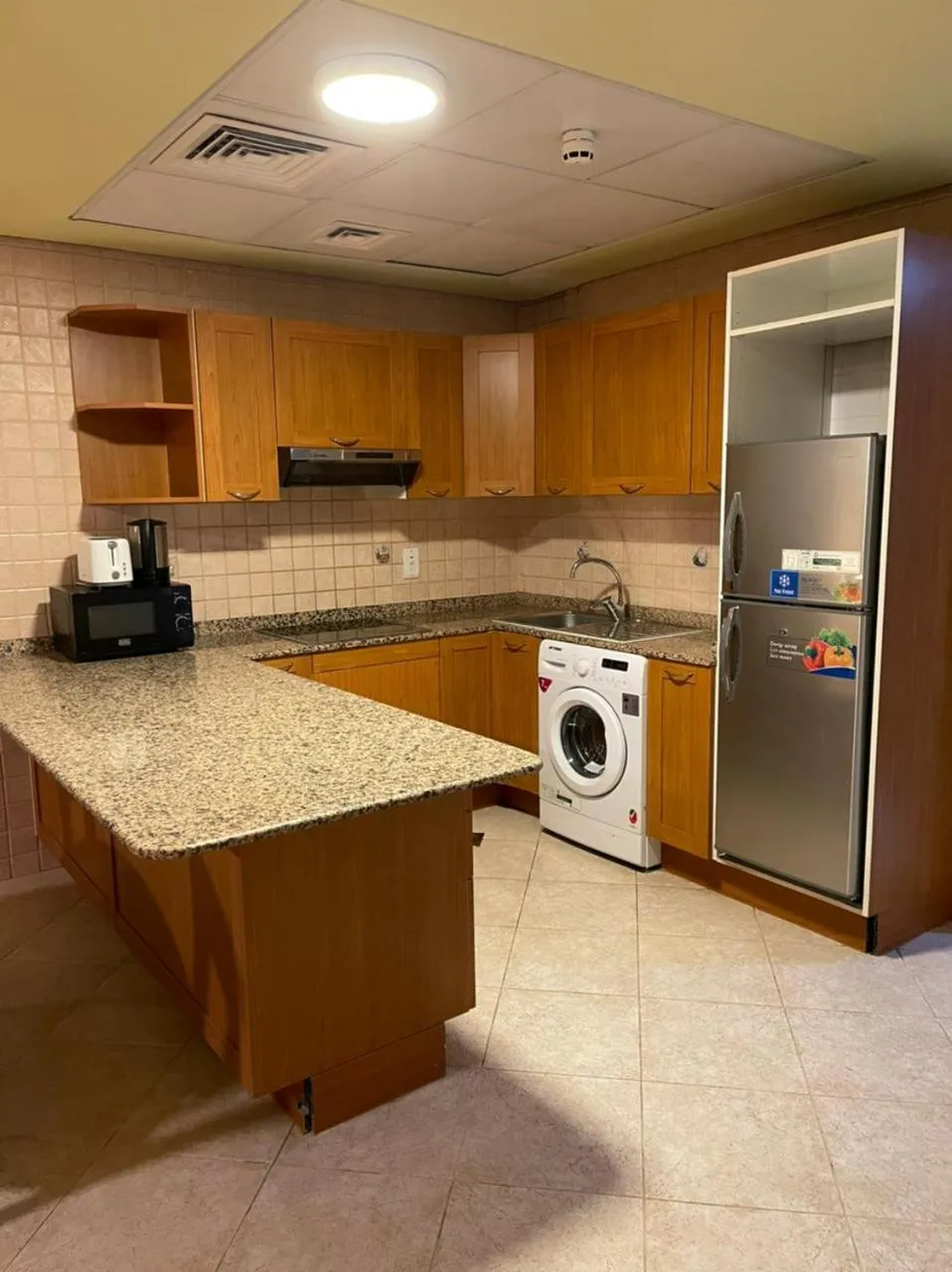 Kitchen or kitchenette in Al Manar Hotel Apartments