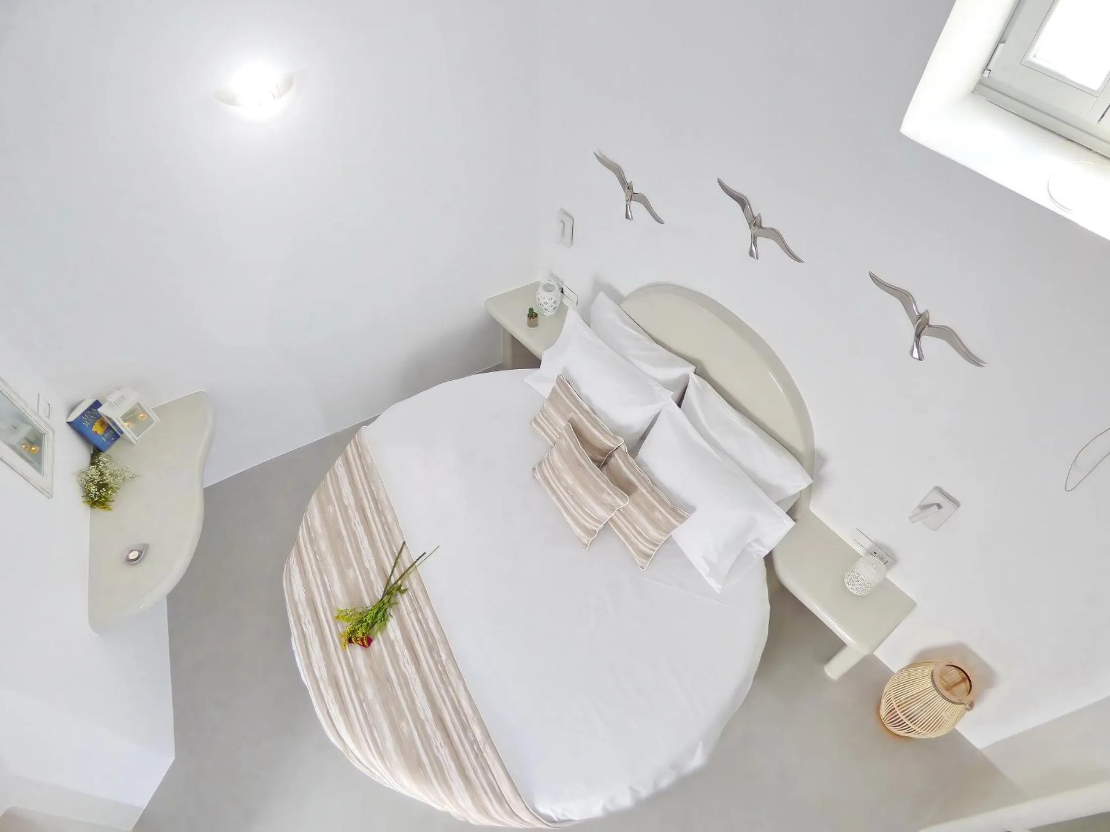 Bed in Golden Stone Santorini Suites