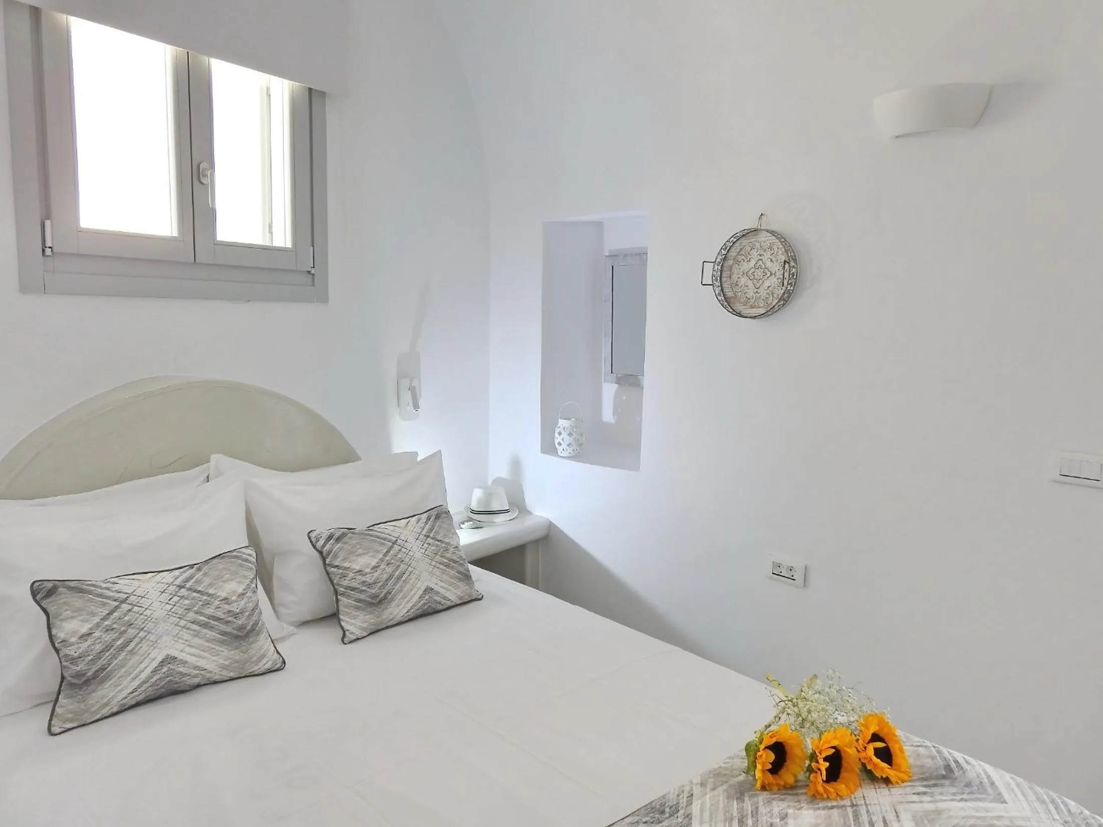 Bed in Golden Stone Santorini Suites