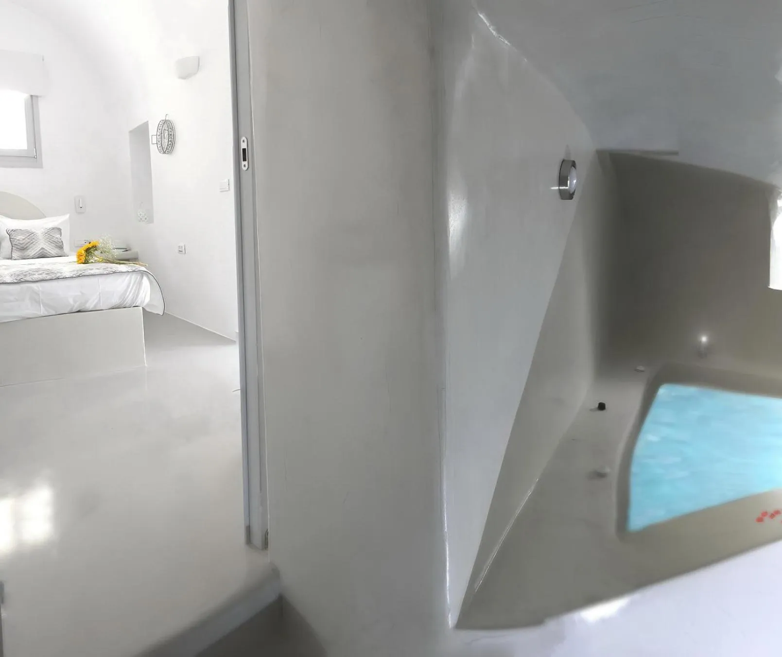 Bed in Golden Stone Santorini Suites