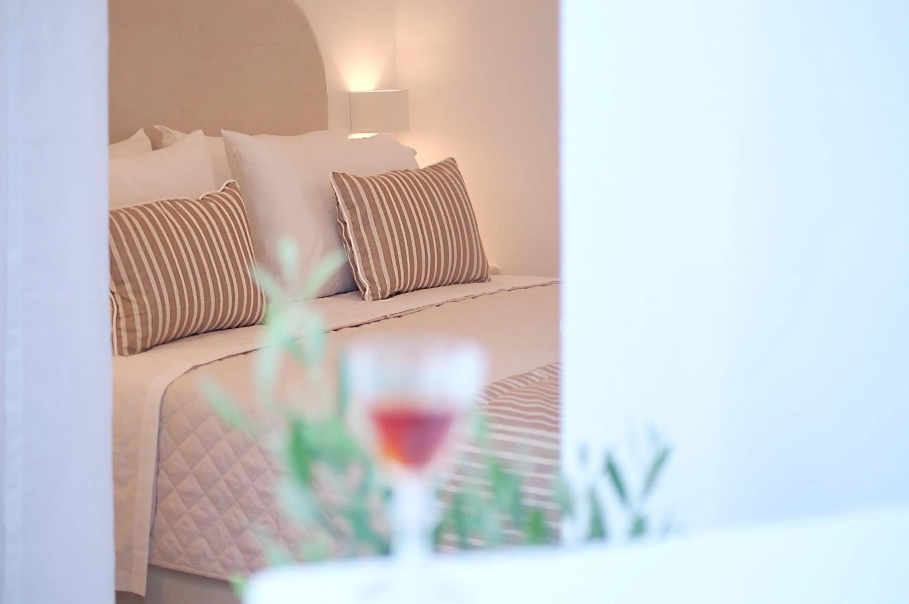 Bed in Golden Stone Santorini Suites