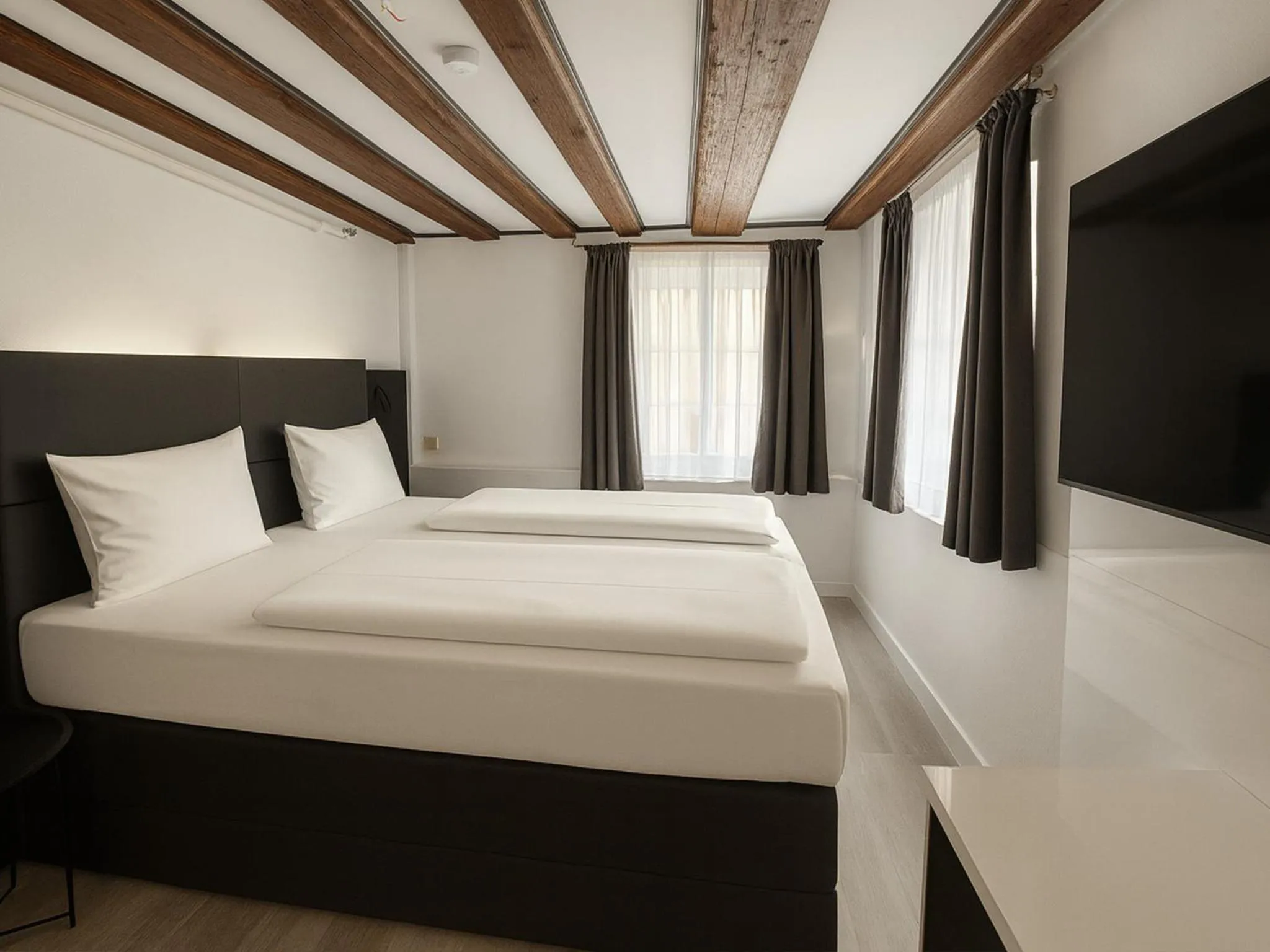 Photo of the whole room, Bed in DORMERO Hotel Schwäbisch Hall