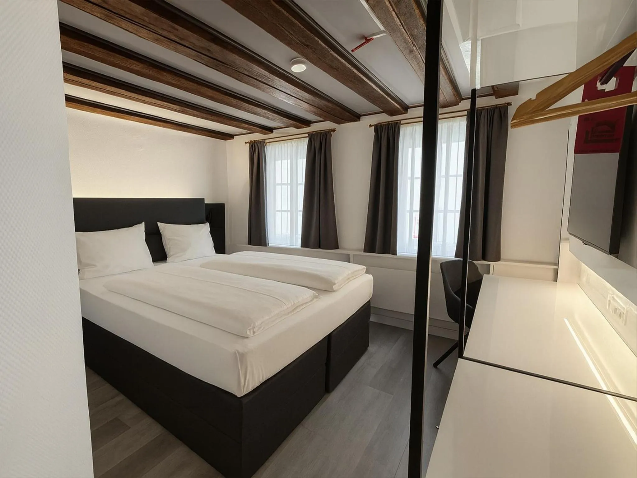 Photo of the whole room, Bed in DORMERO Hotel Schwäbisch Hall