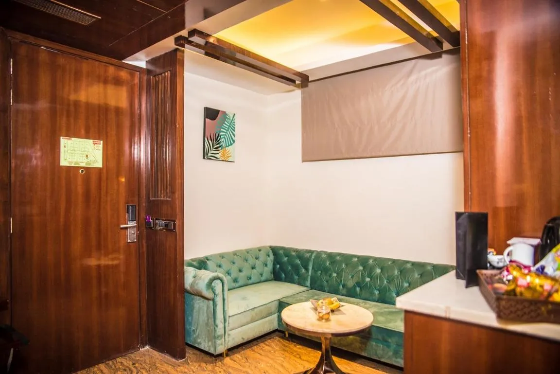 Living room in Regenta Inn Amristar Airport Road by Royal Orchid Hotels Limited