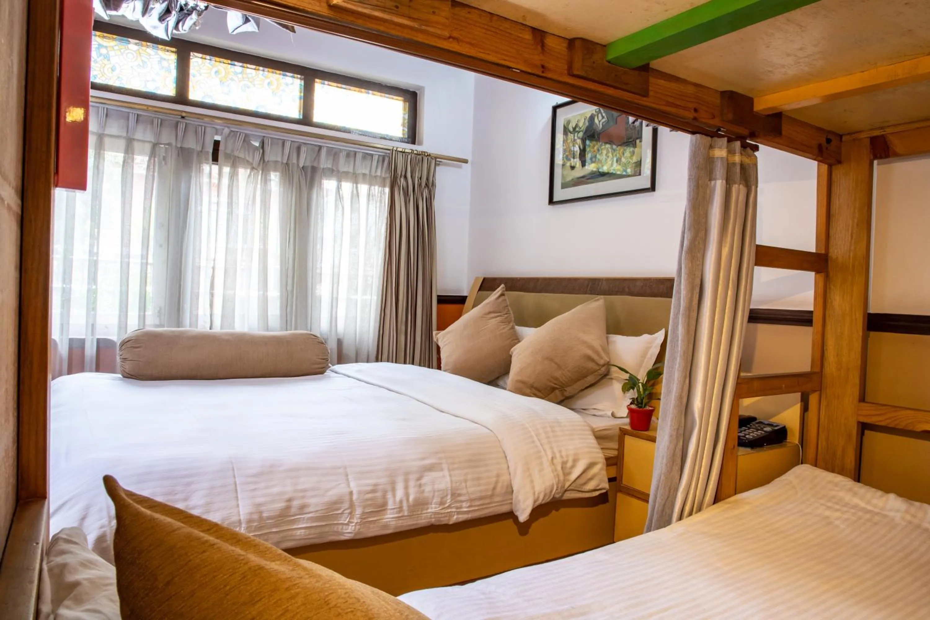 Bed in Shangrila Boutique Hotel