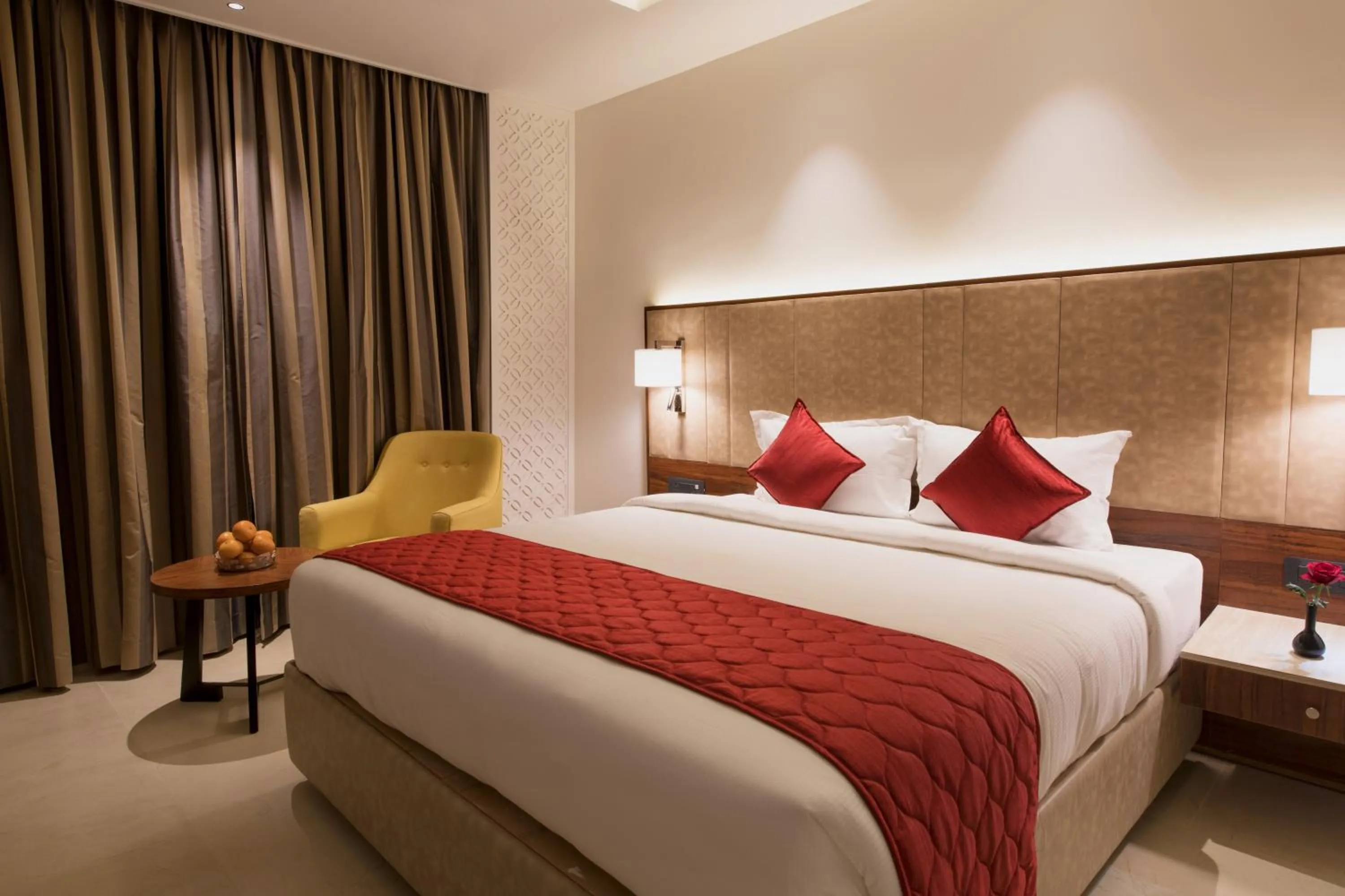 Bed in AARYA MANSION V One Hotel