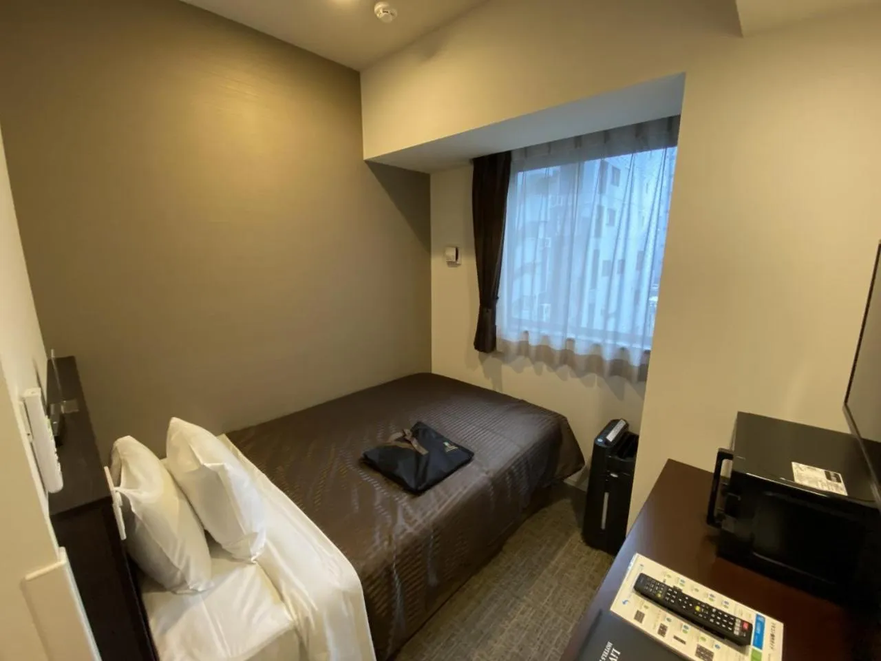 Bed in HOTEL LiVEMAX PREMIUM Nagoya Marunouchi