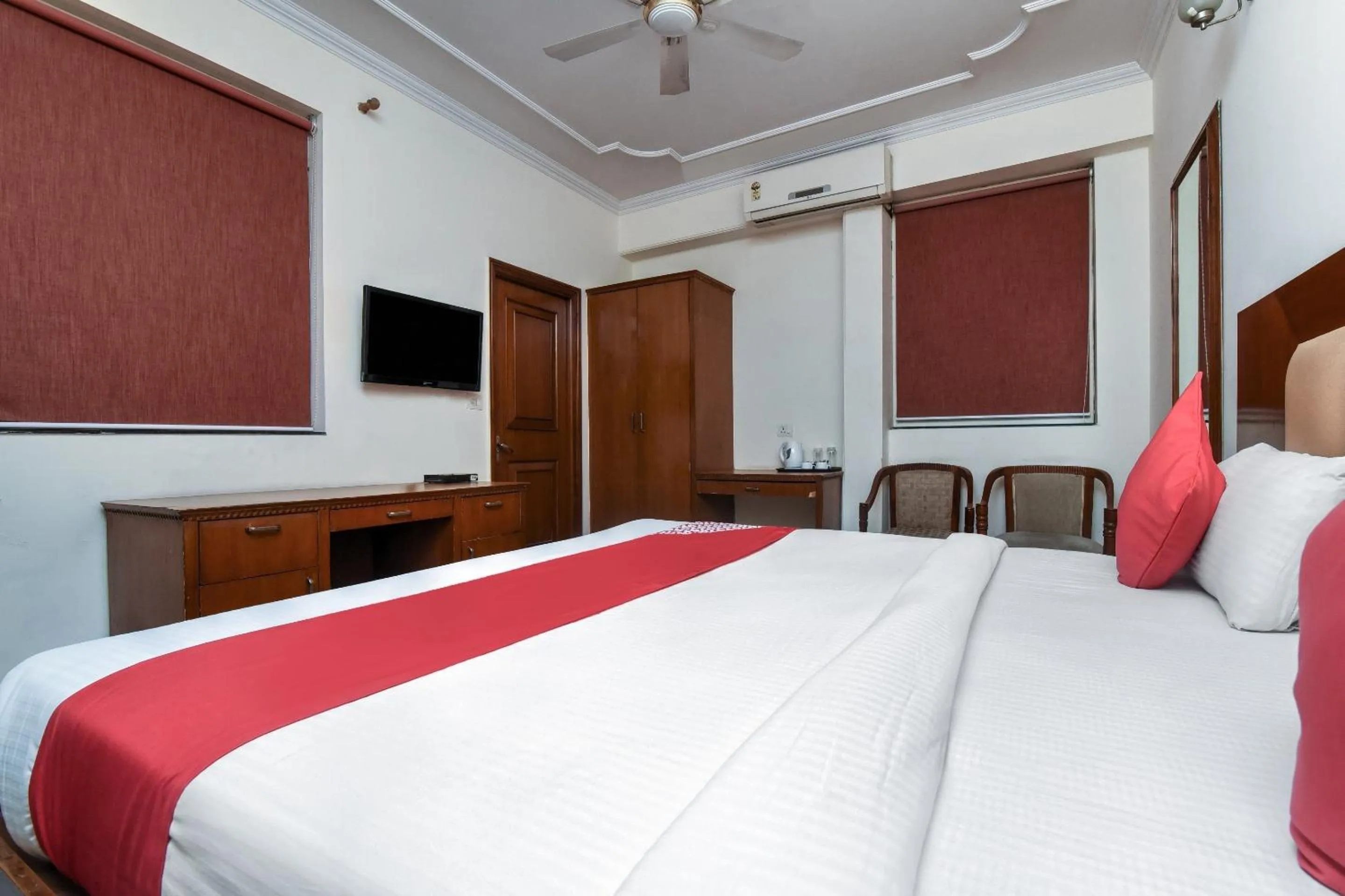 Bedroom in Capital O Corporate Inn