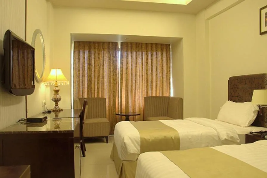 Bedroom, Bed in Pramod Convention & Club Resort