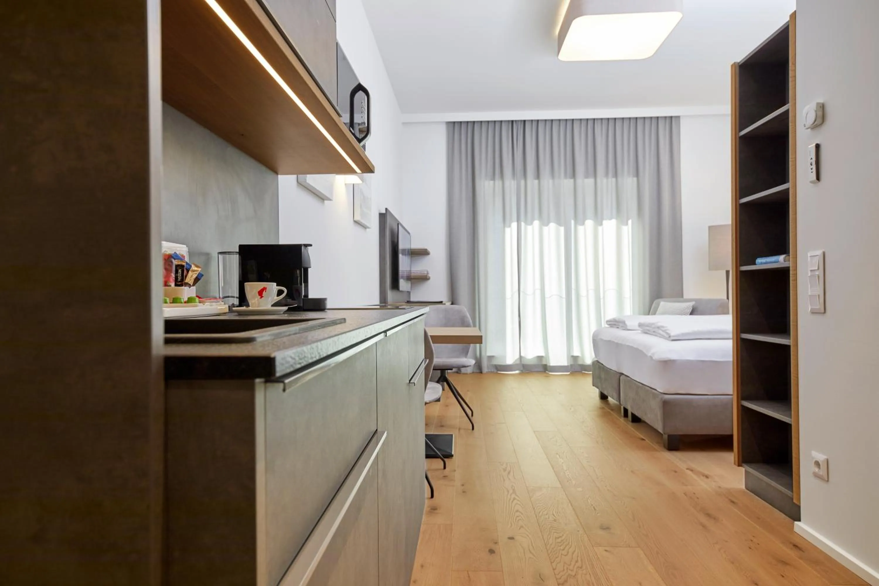 Kitchen or kitchenette, Bed in Hotel Gösser Bräu