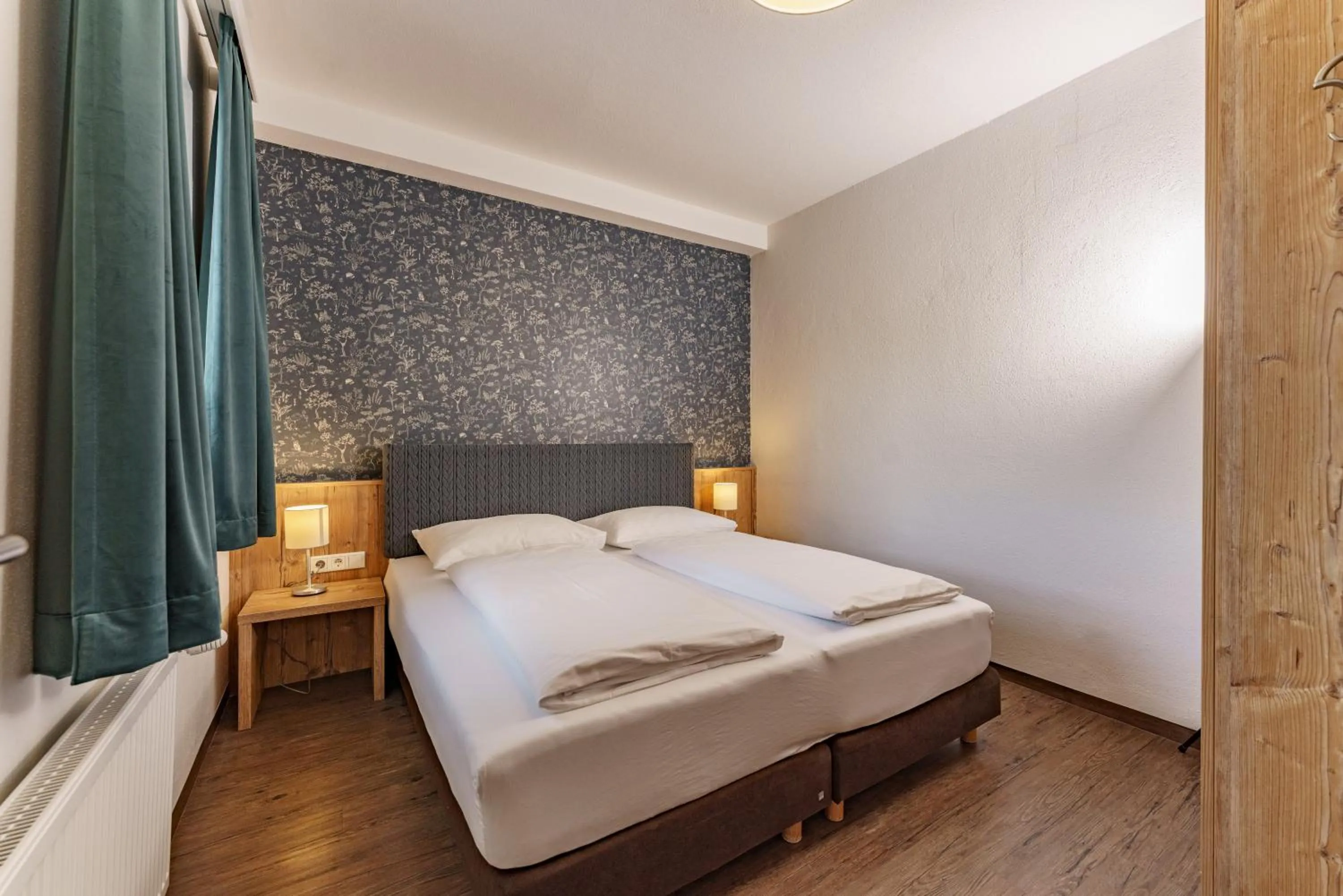 Bedroom, Bed in Appartements Landhaus Hubertus Wellness & Breakfast