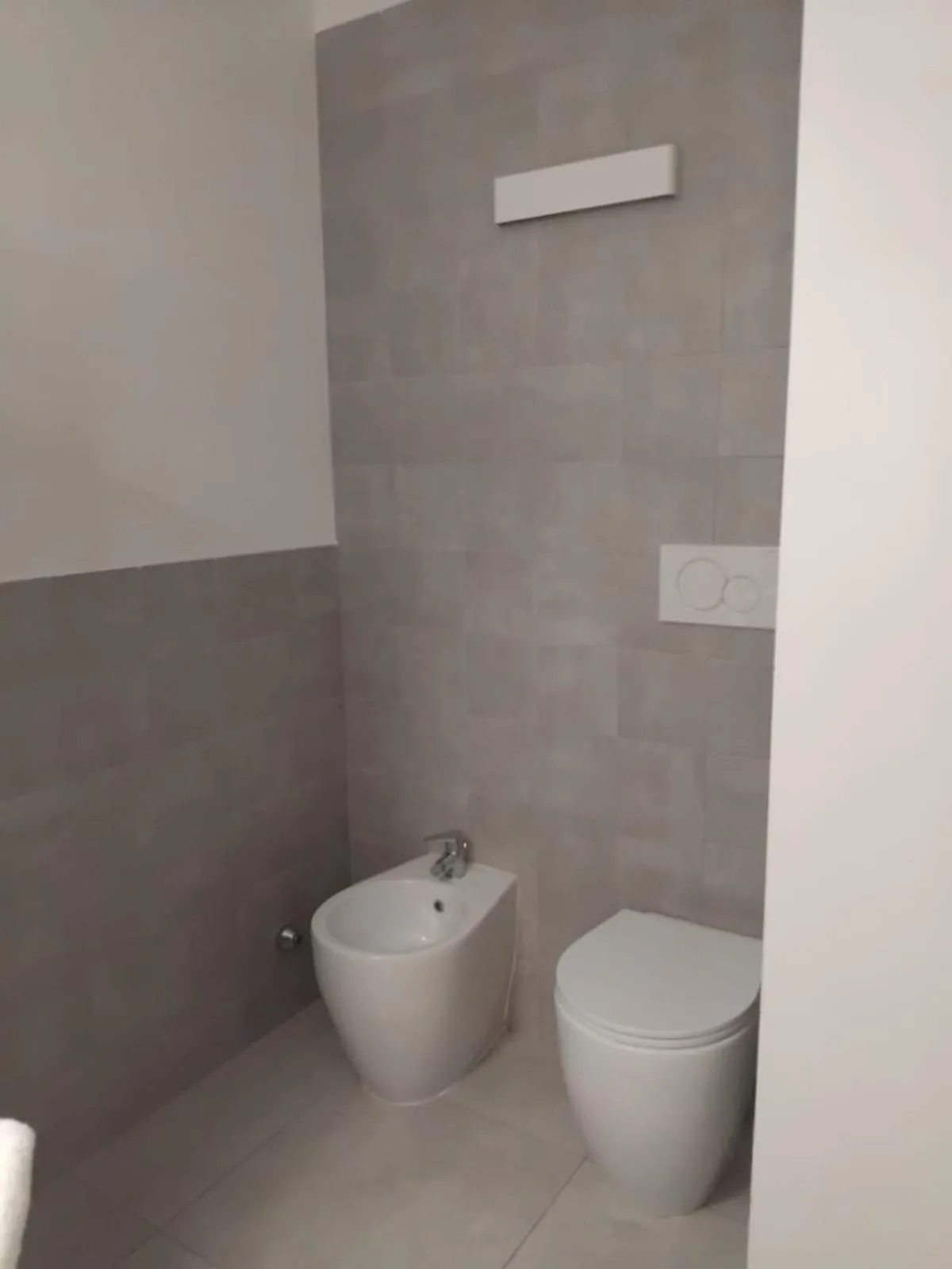 Toilet in Venice Terminal Apartments & Suites