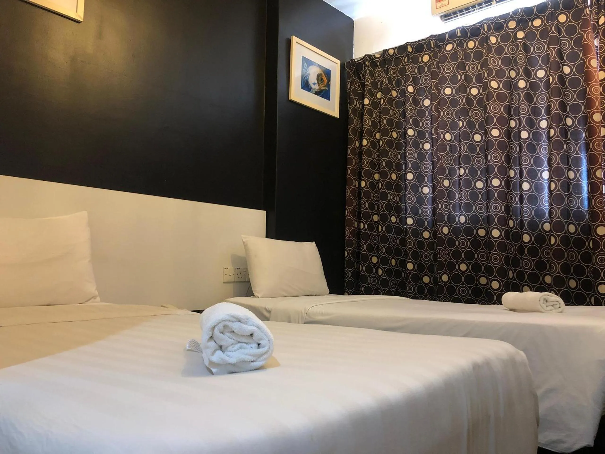 Bed in Ridel Sunset Hotel