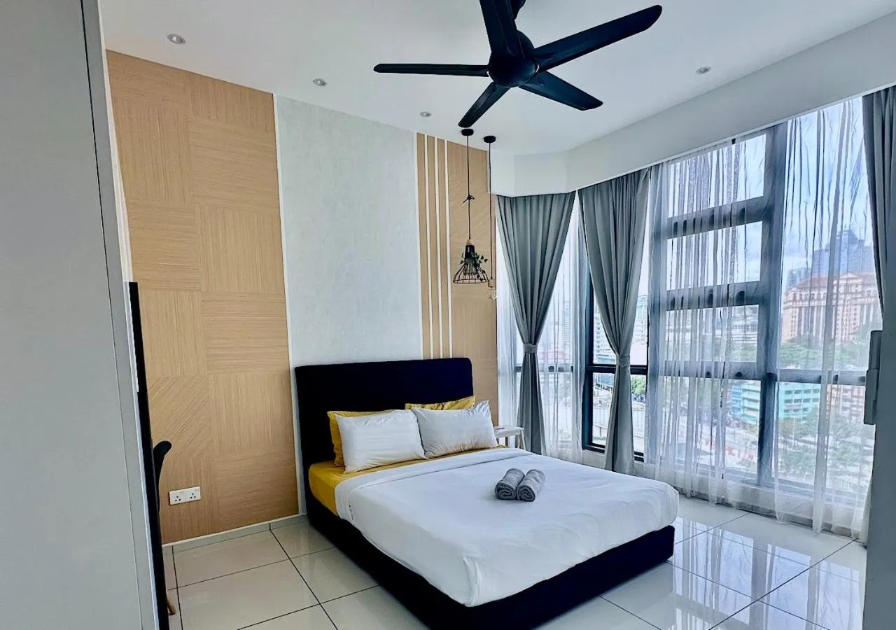 Bed in Robertson PanoramaKL Suites