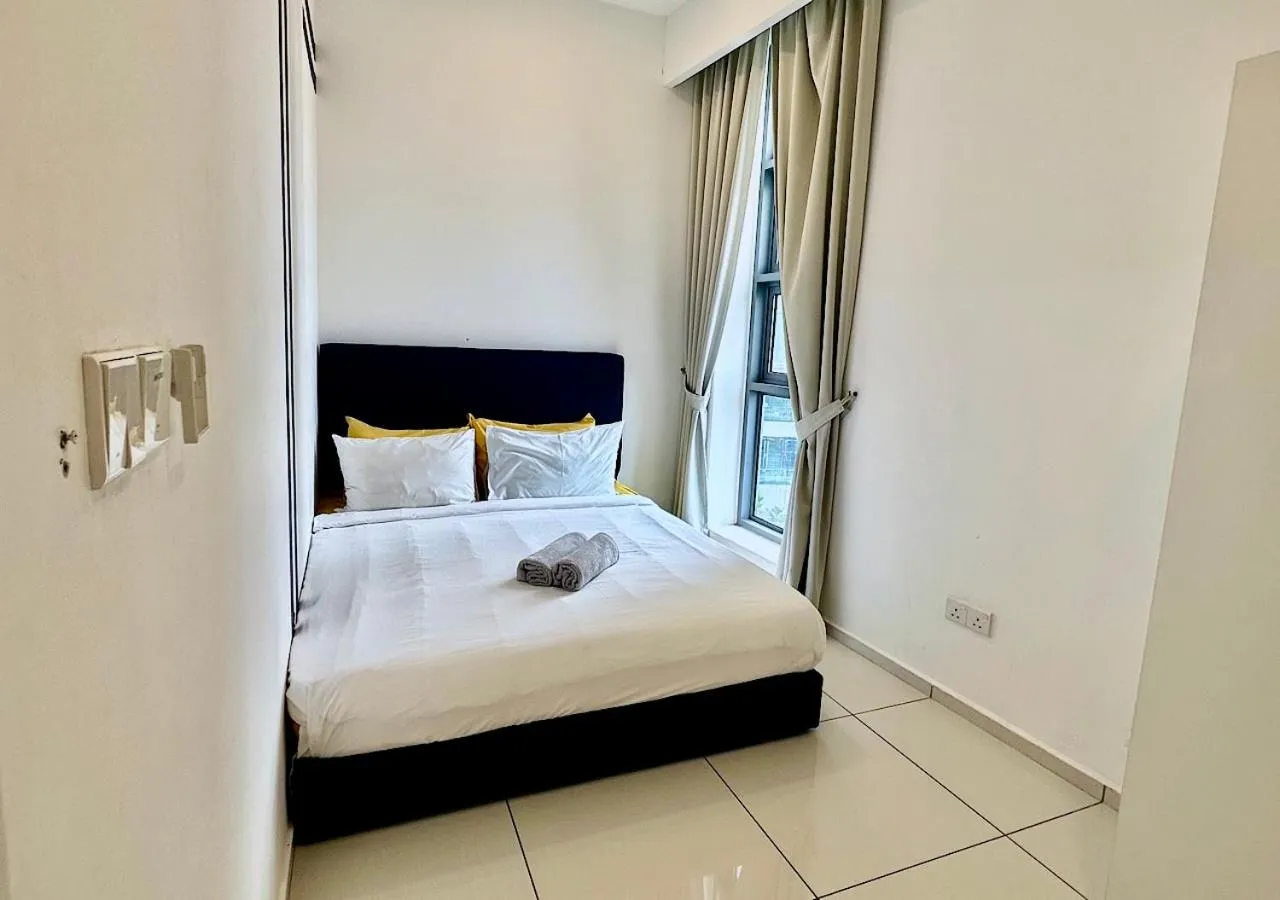 Bed in Robertson PanoramaKL Suites