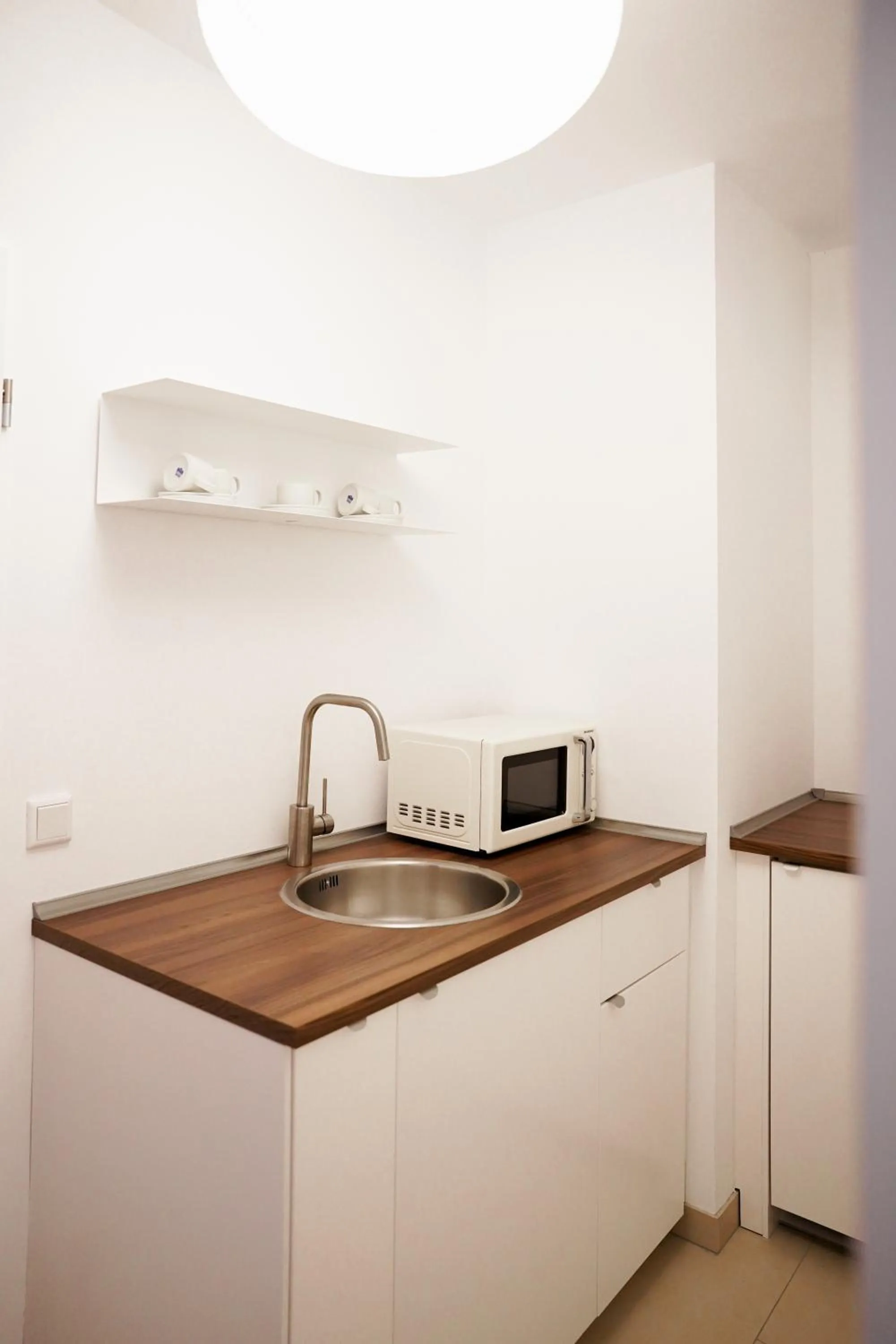 Kitchen or kitchenette in urraum Hotel