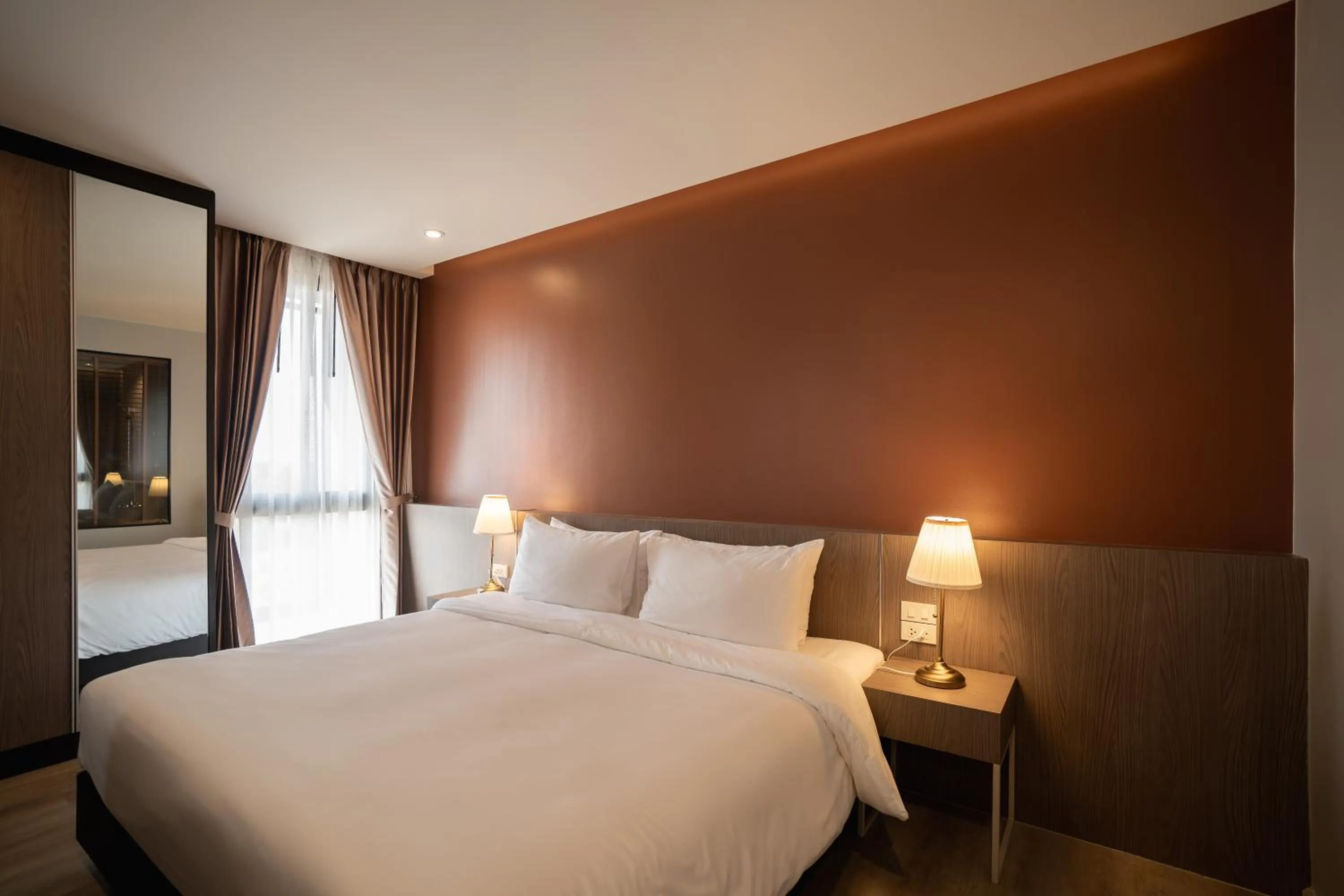 Bed in The Rise Suites Hotel, Chiang Mai - SHA Extra Plus