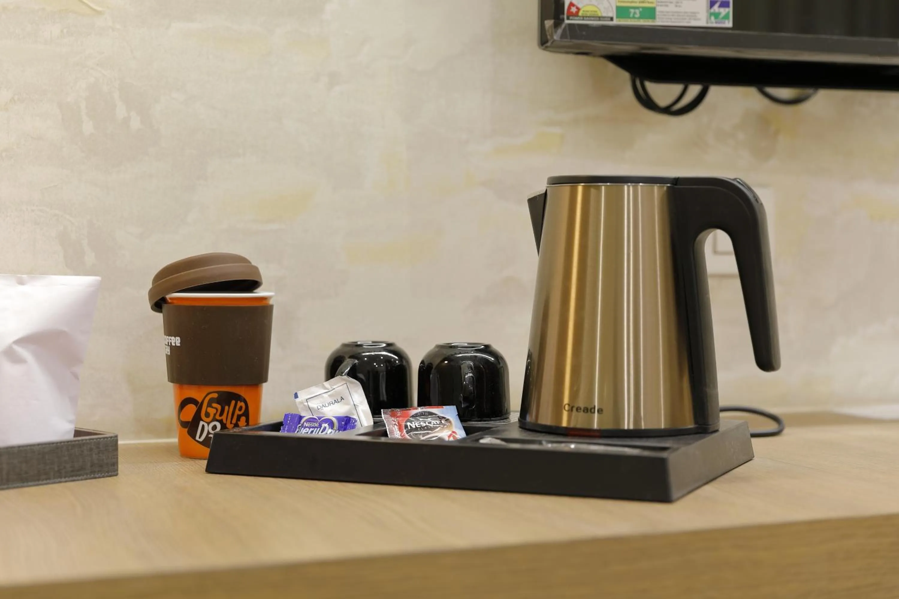 Bedroom in Hotel Elysian Residency