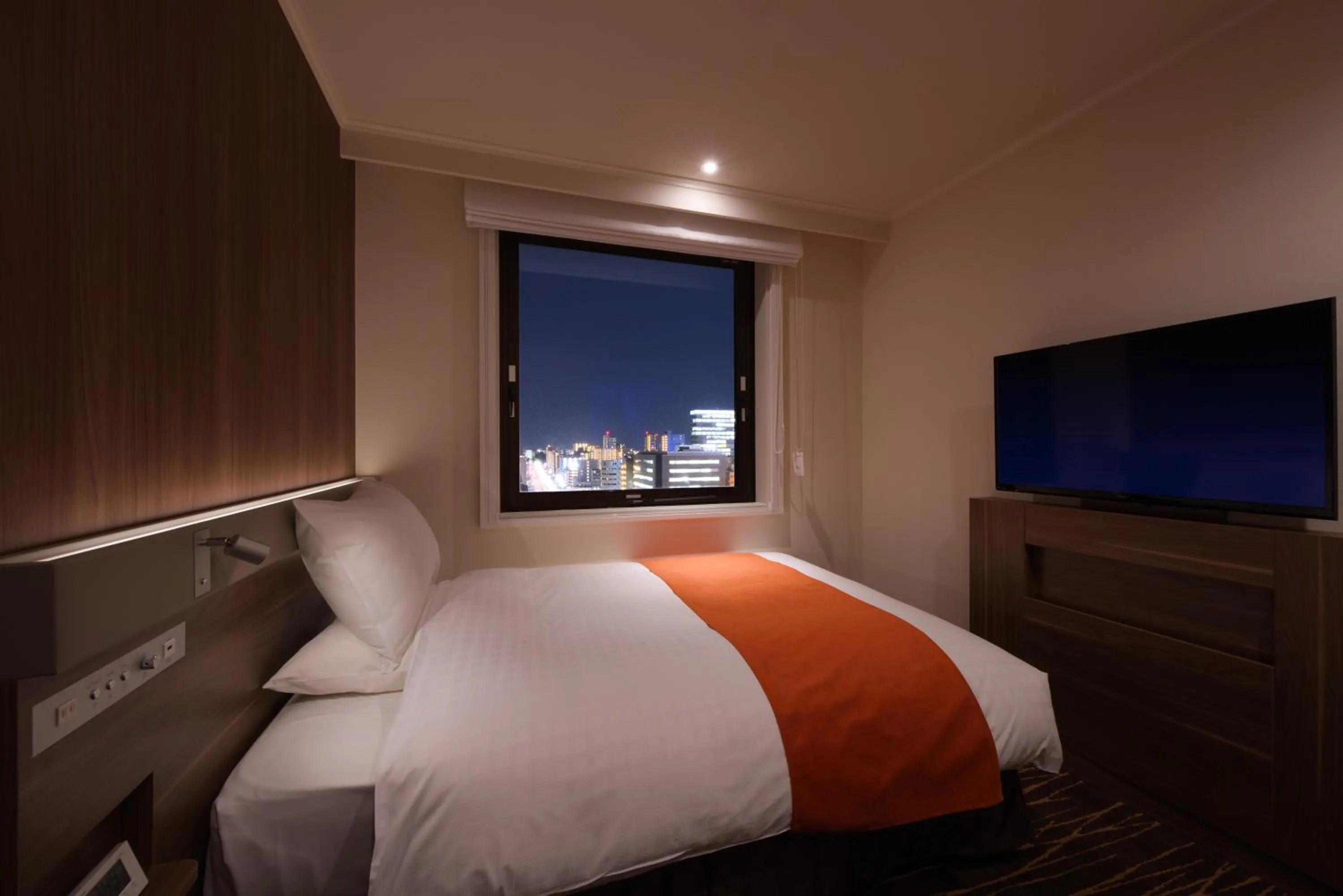 Bed in Hotel JAL City Sendai