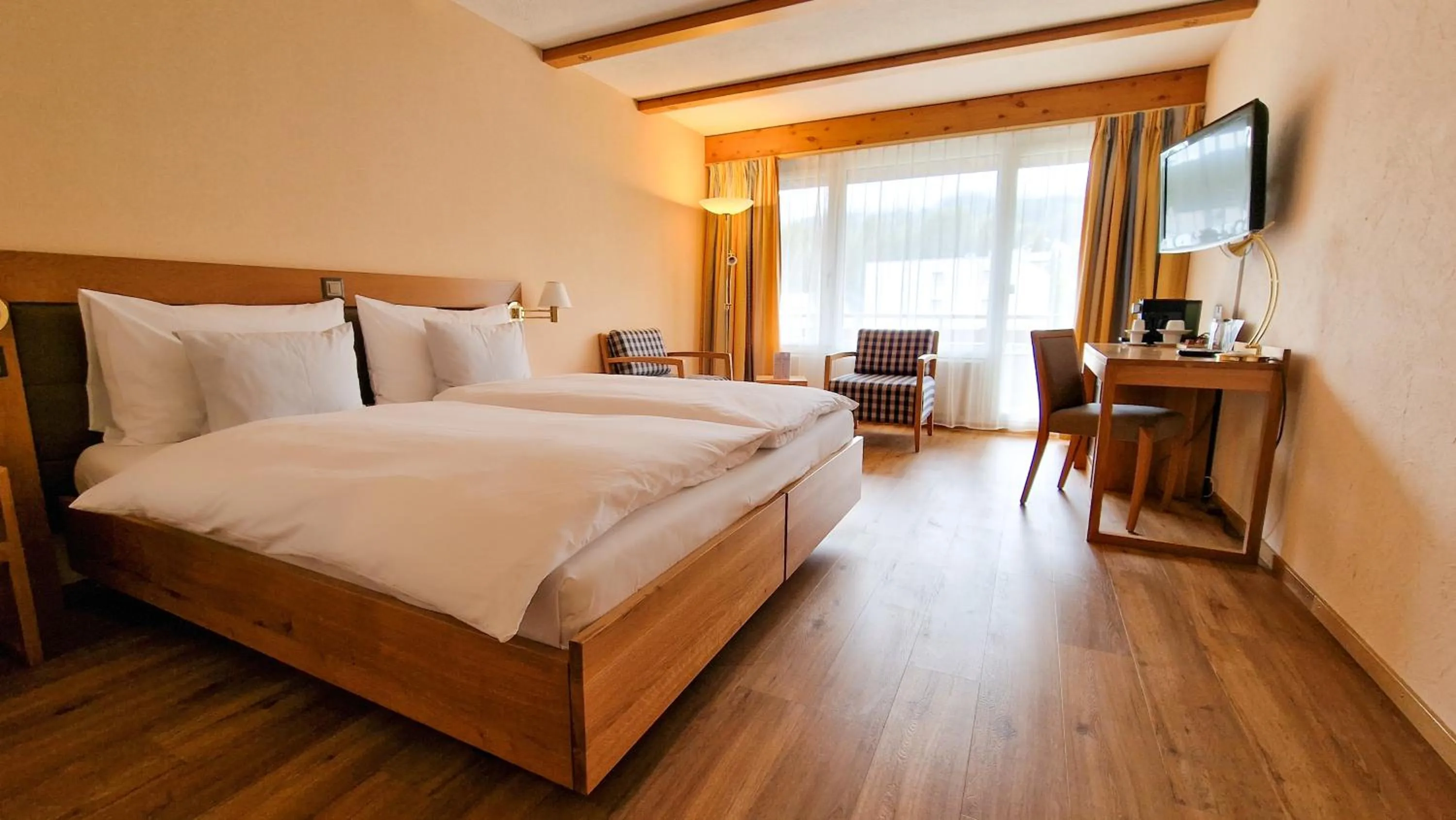 Photo of the whole room, Bed in Sunstar Hotel Lenzerheide