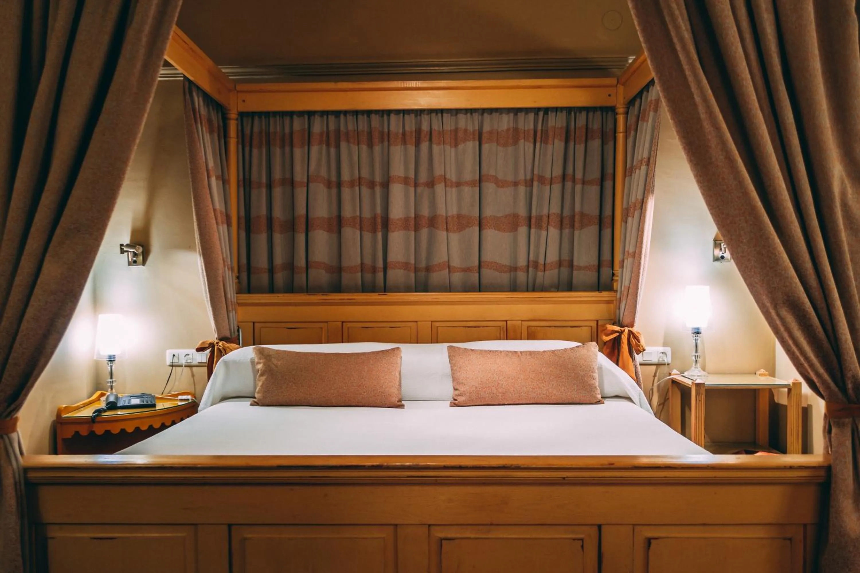 Bed in Hotel Carabeo