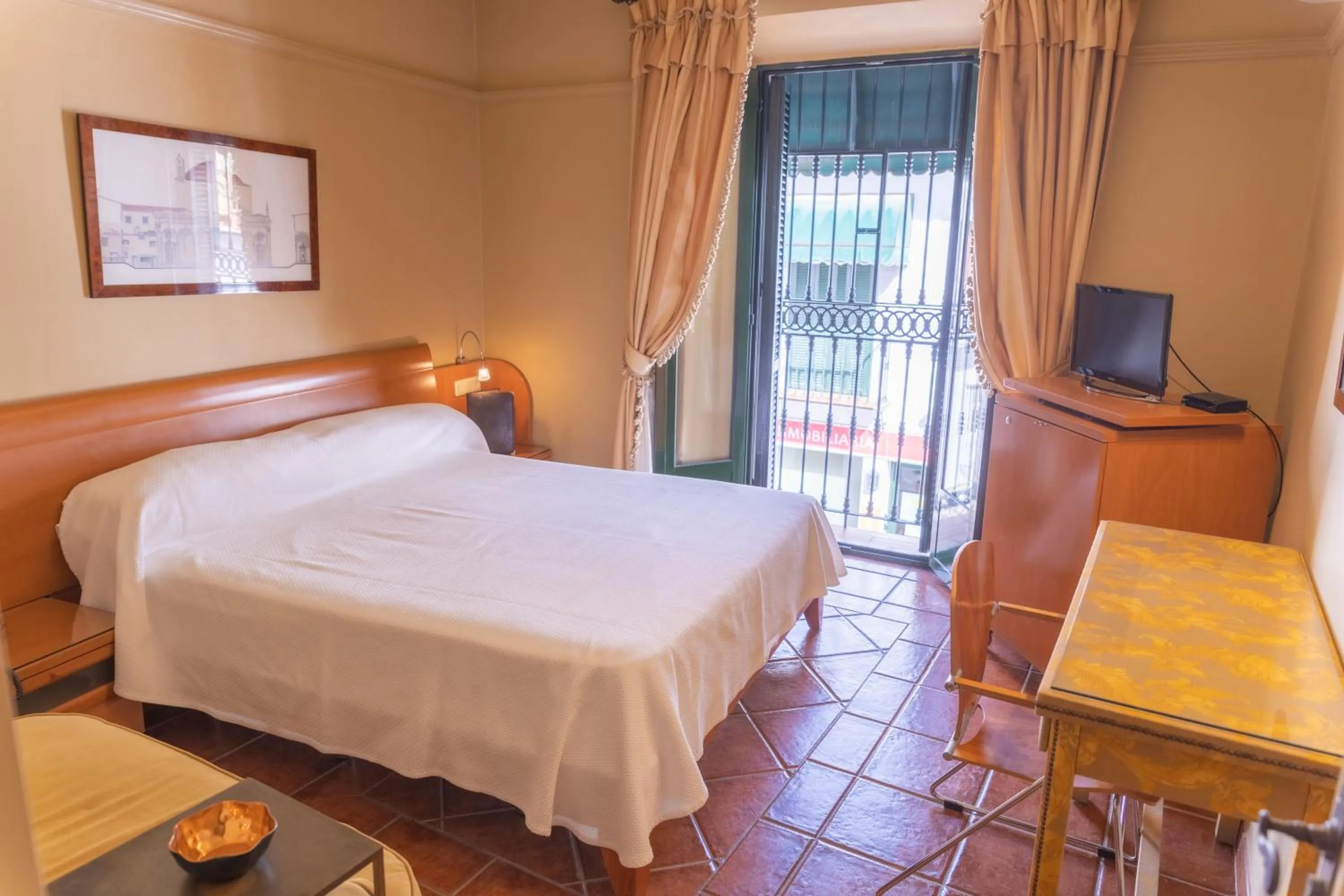 Bed in Hotel Carabeo