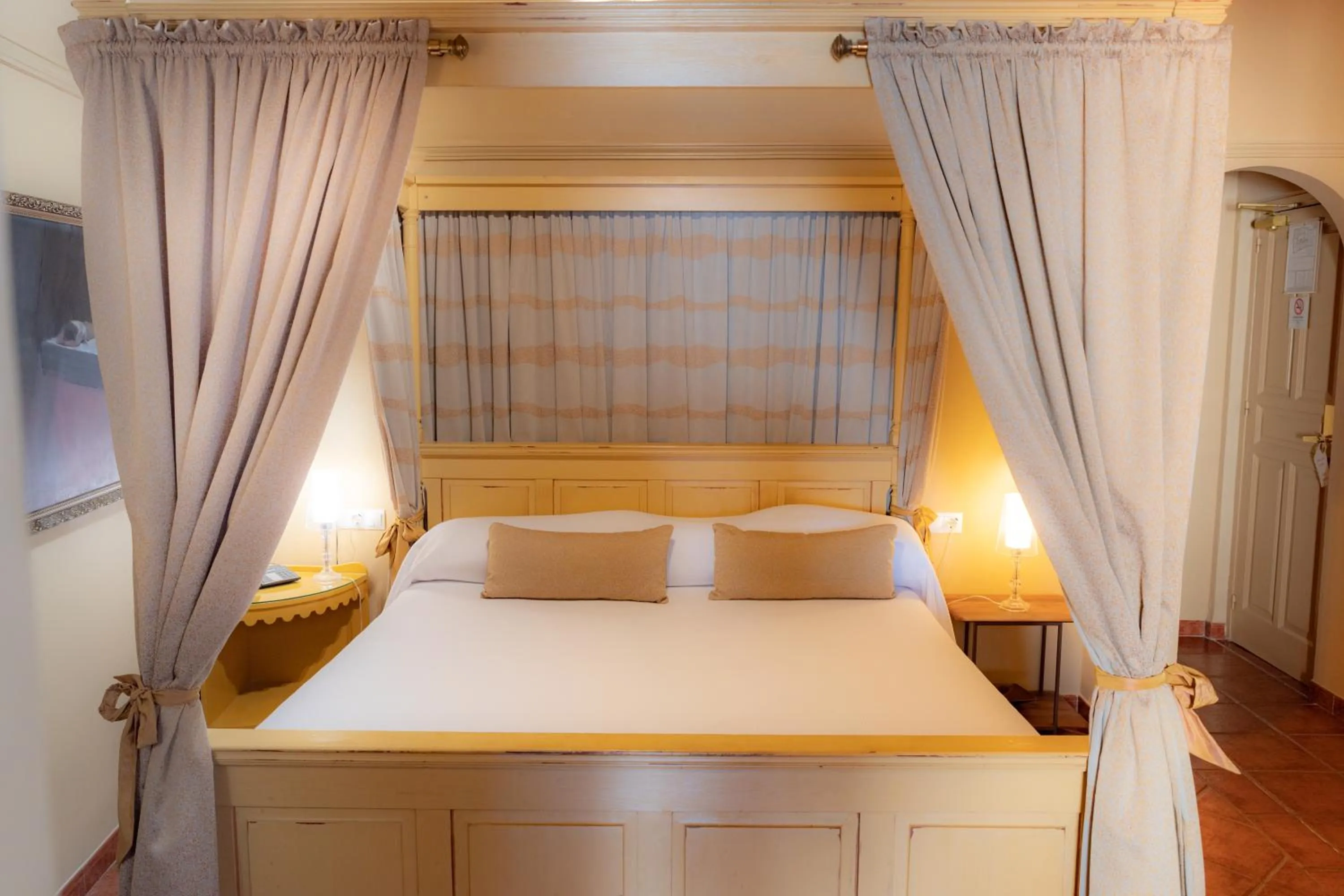 Bed in Hotel Carabeo