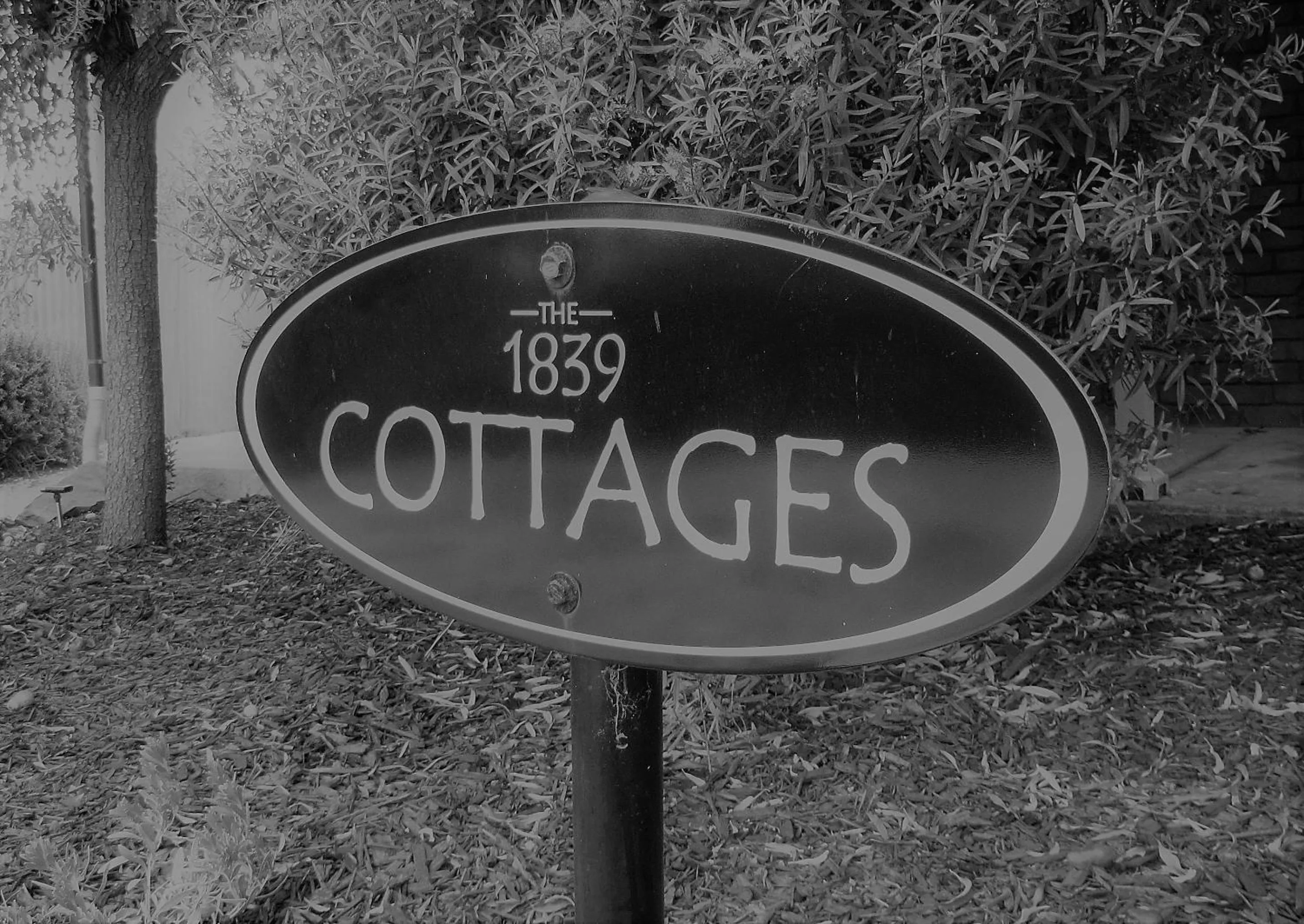 Property logo or sign in 1839 Cottages