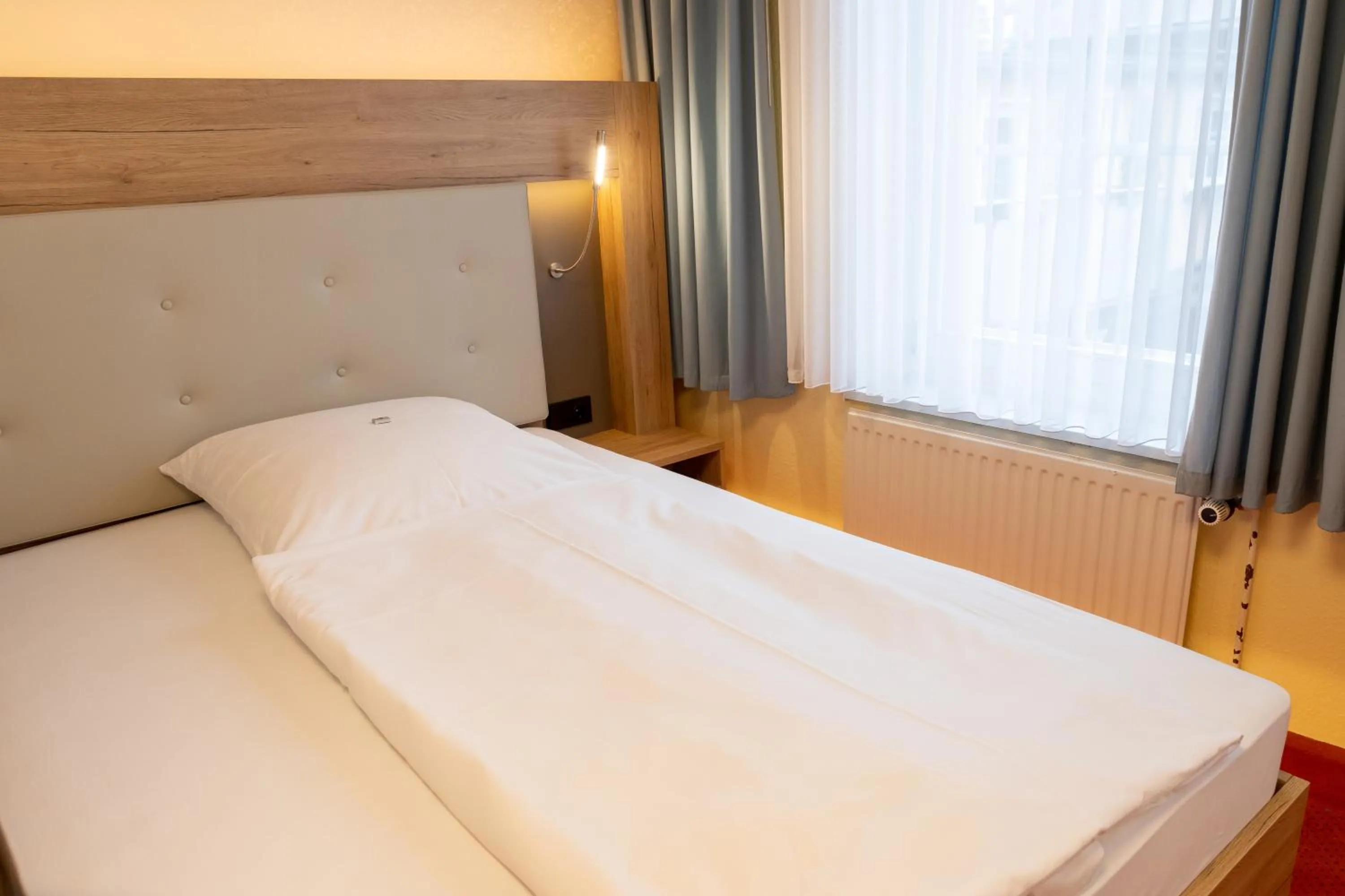 Bed in Flair Hotel Deutsches Haus