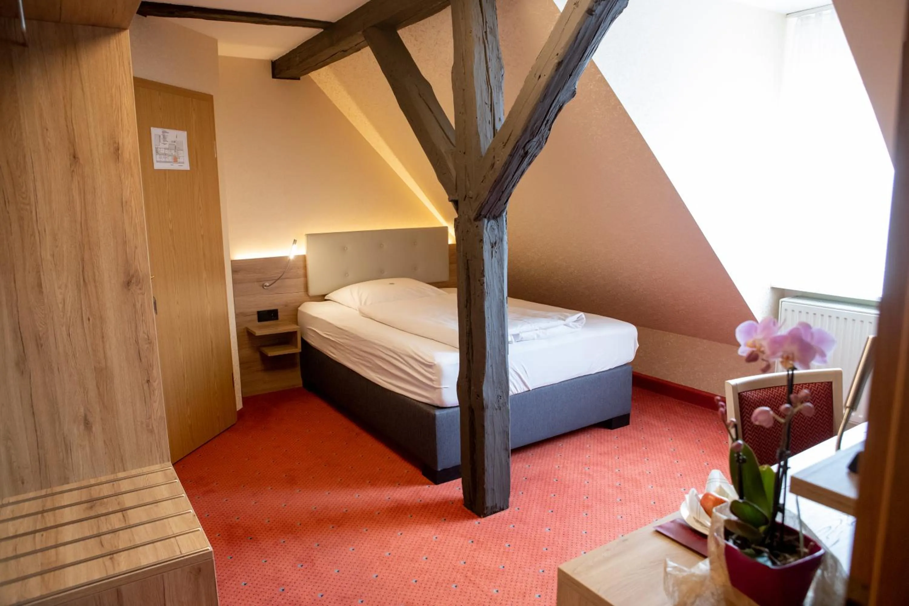 Bed in Flair Hotel Deutsches Haus