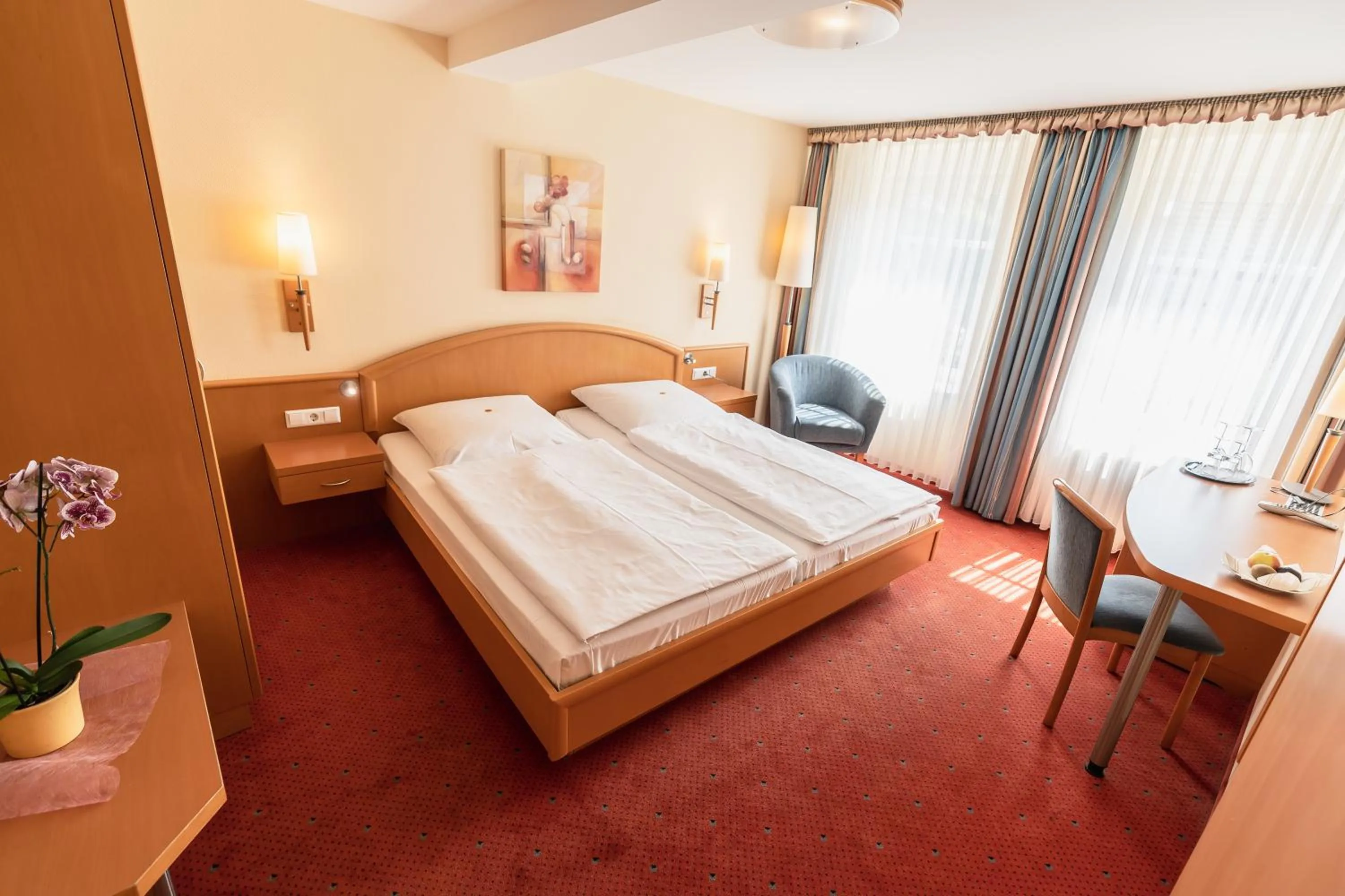 Bed in Flair Hotel Deutsches Haus