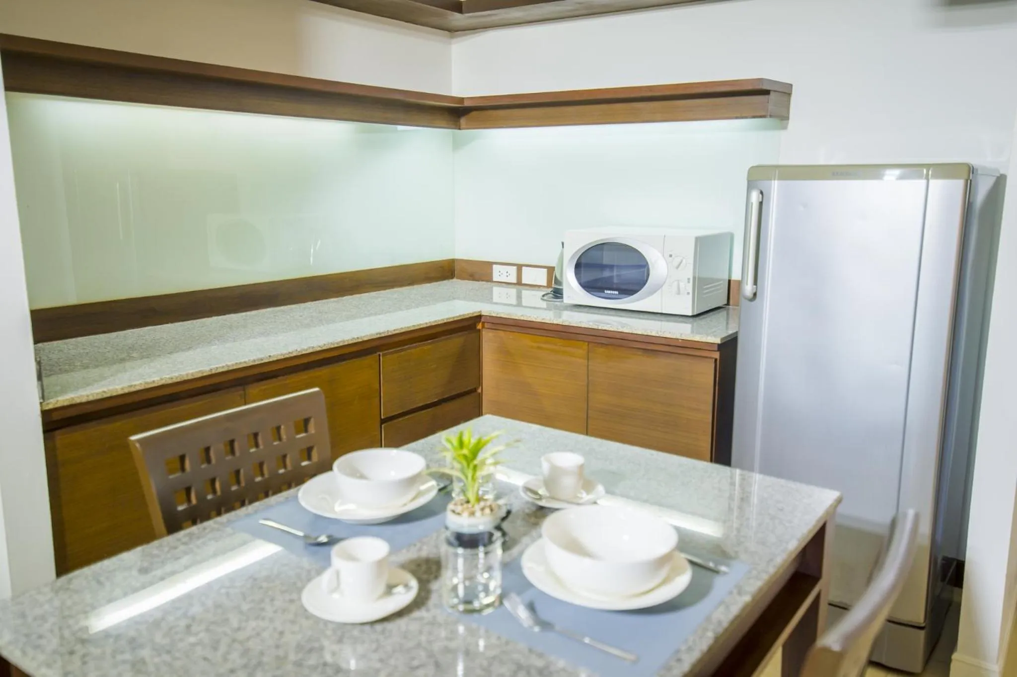 Kitchen or kitchenette in Sitara Place Serviced Apartment & Hotel