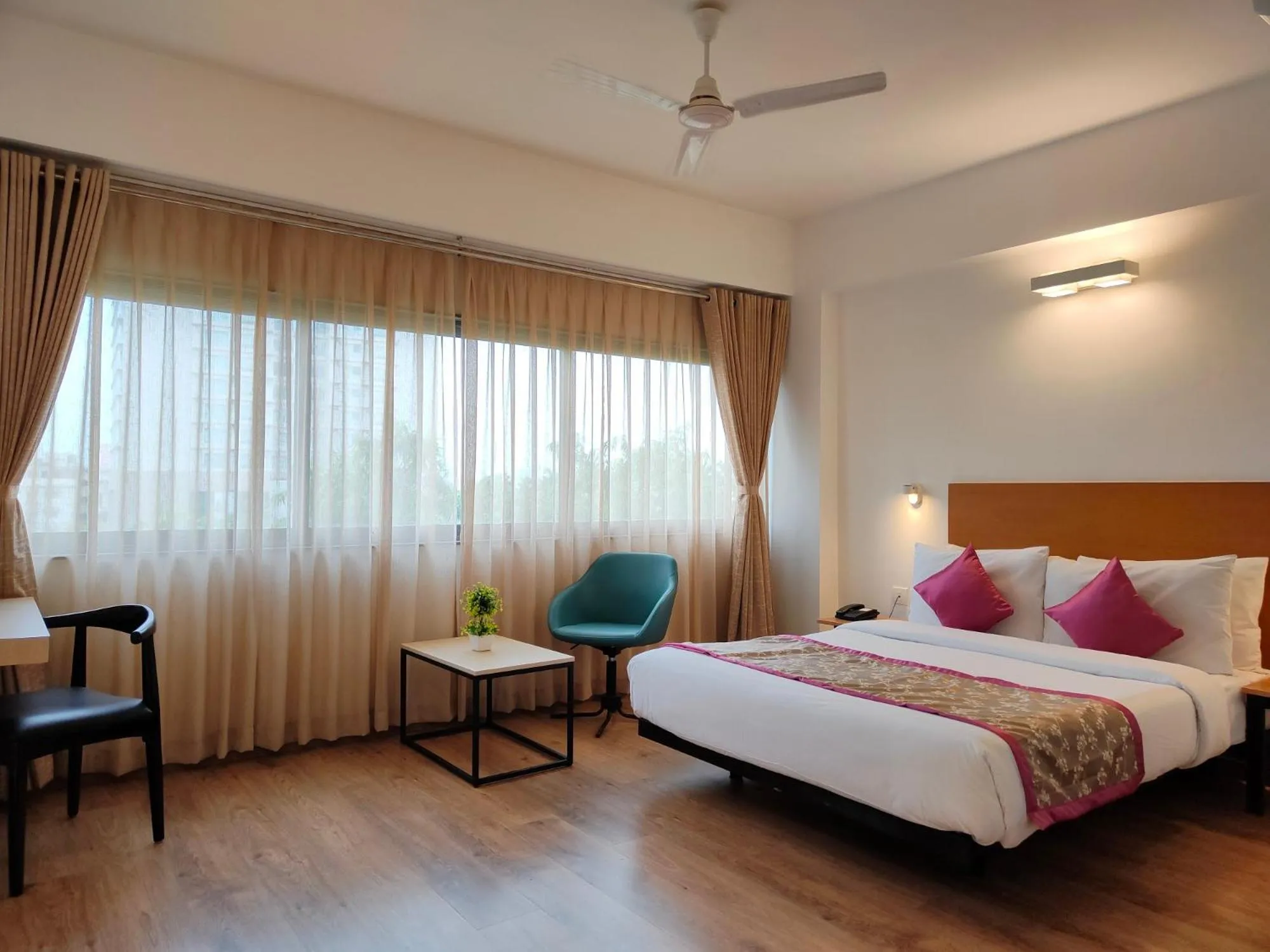 Photo of the whole room, Bed in Kanak Beacon Hotel - Ashram Road Ahmedabad
