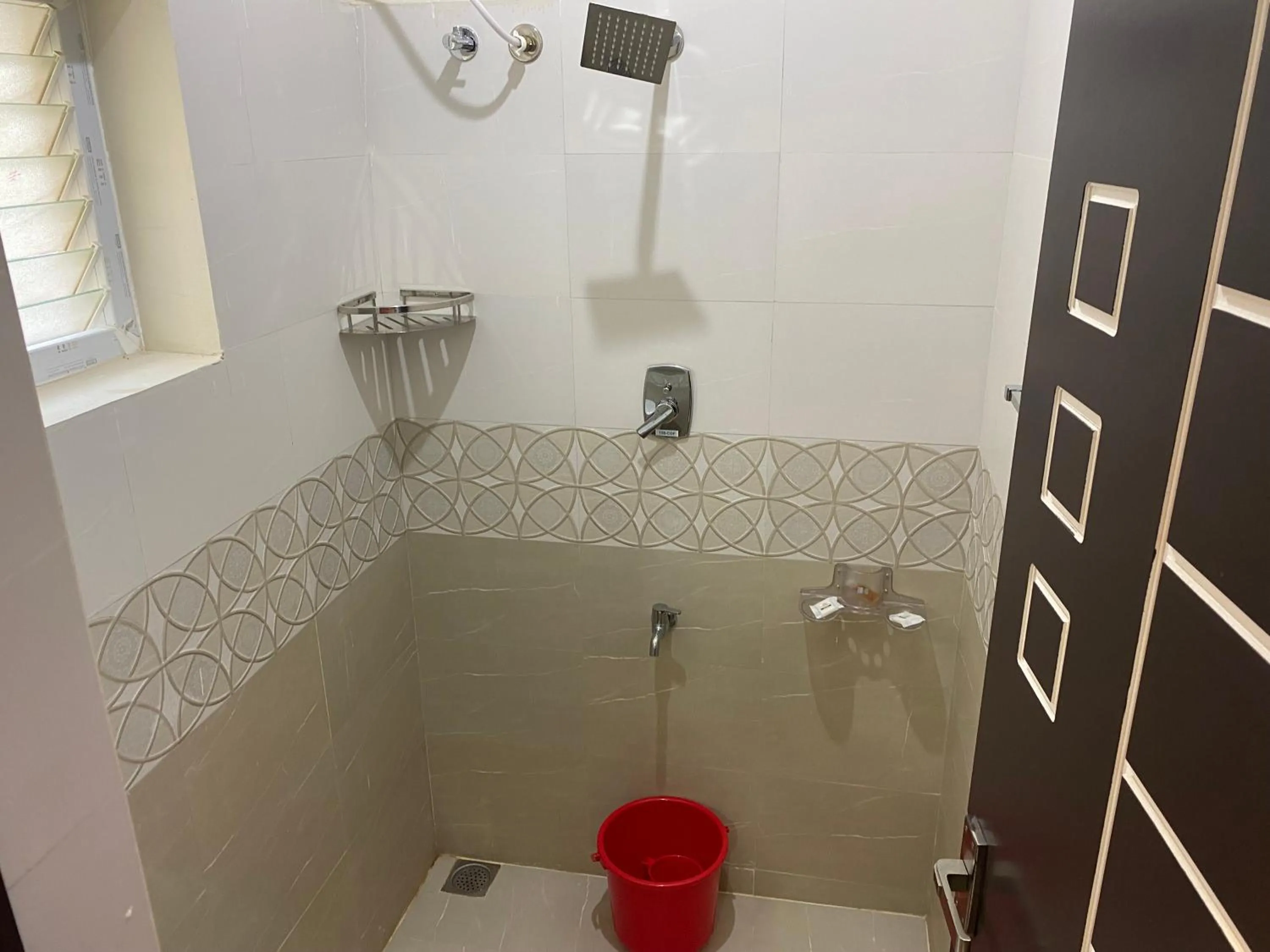 Shower in Hotel Akshith Inn
