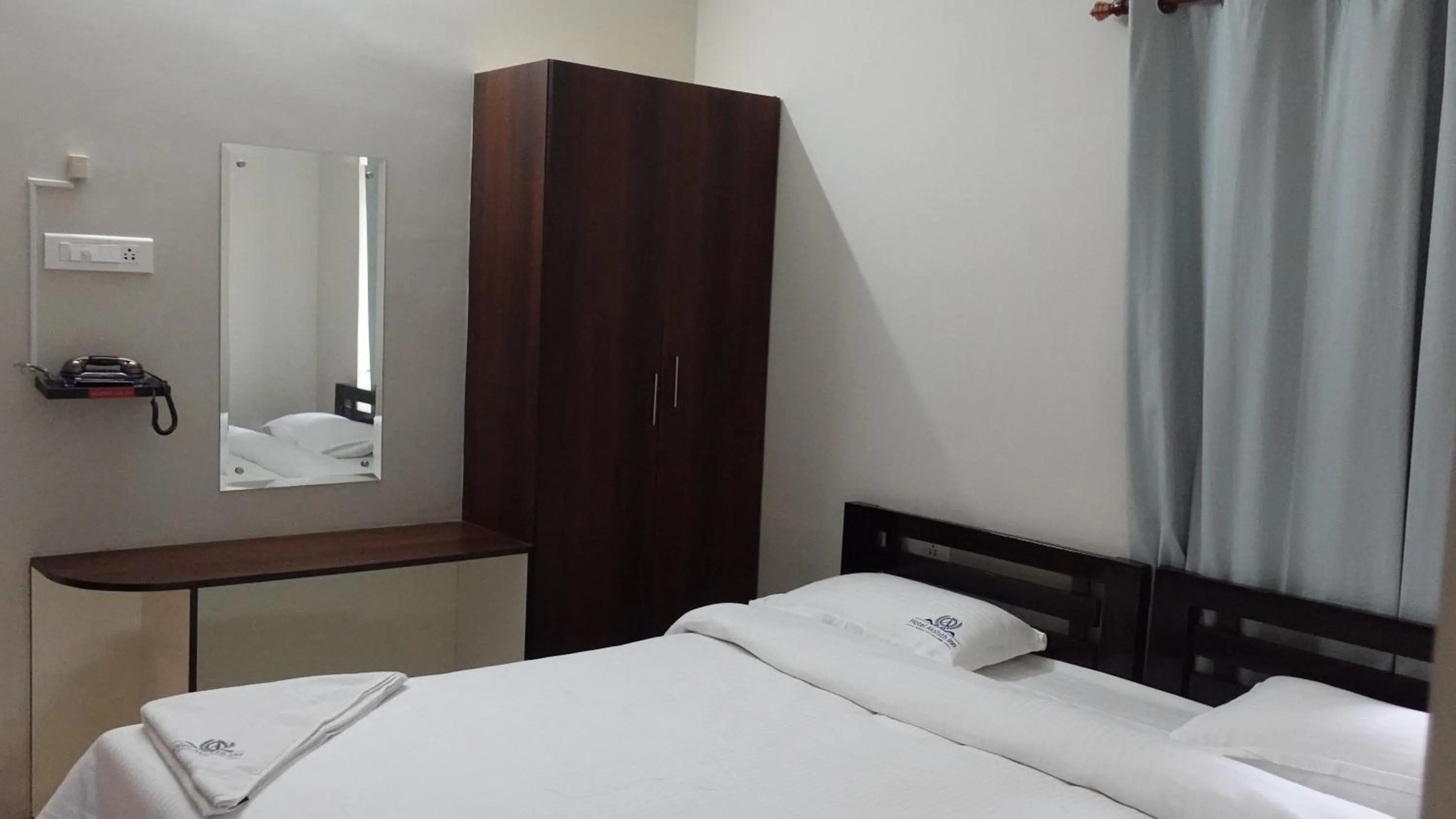 Bed in Hotel Akshith Inn