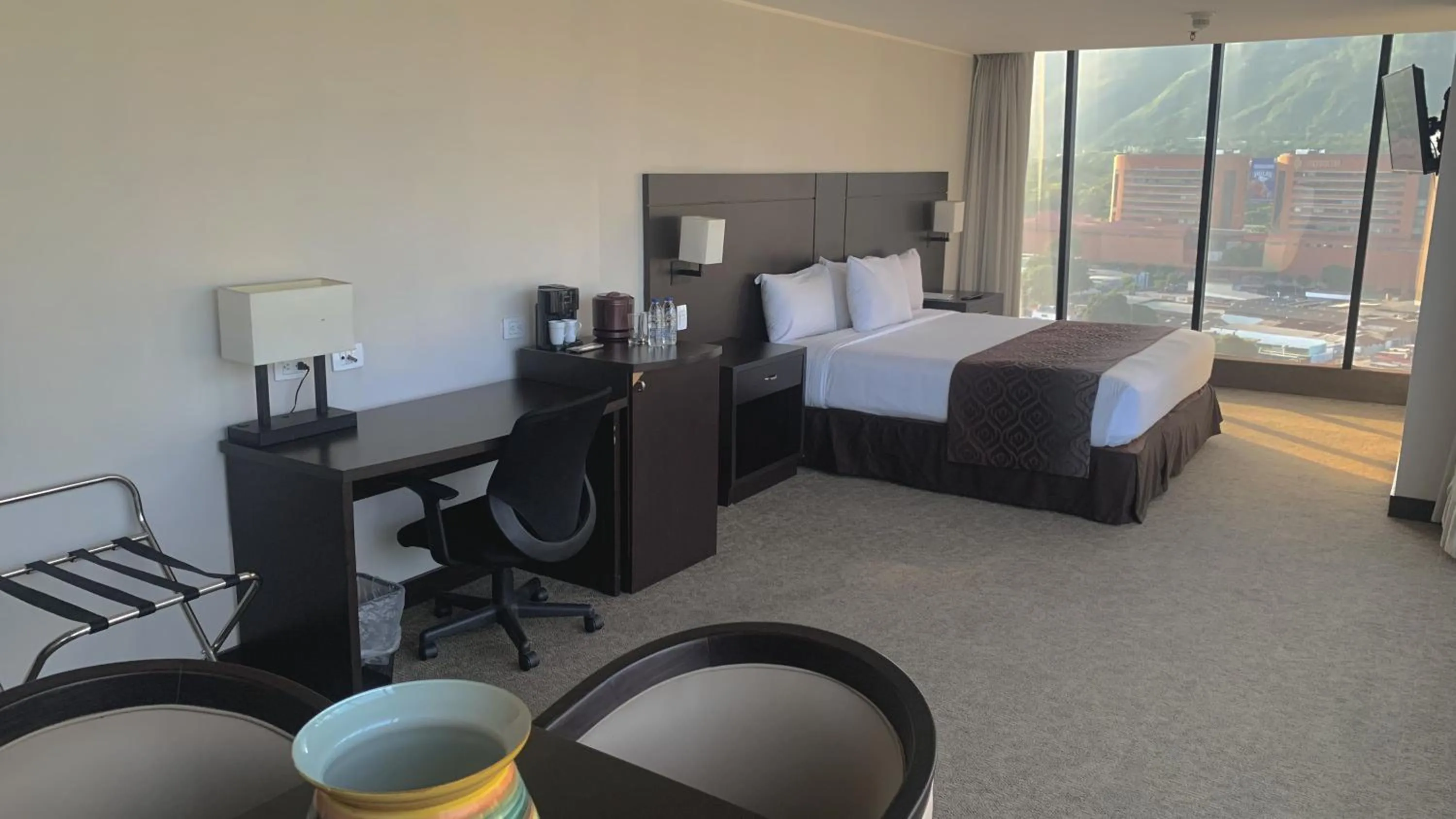 Bed in HOTEL CHACAO SUITES