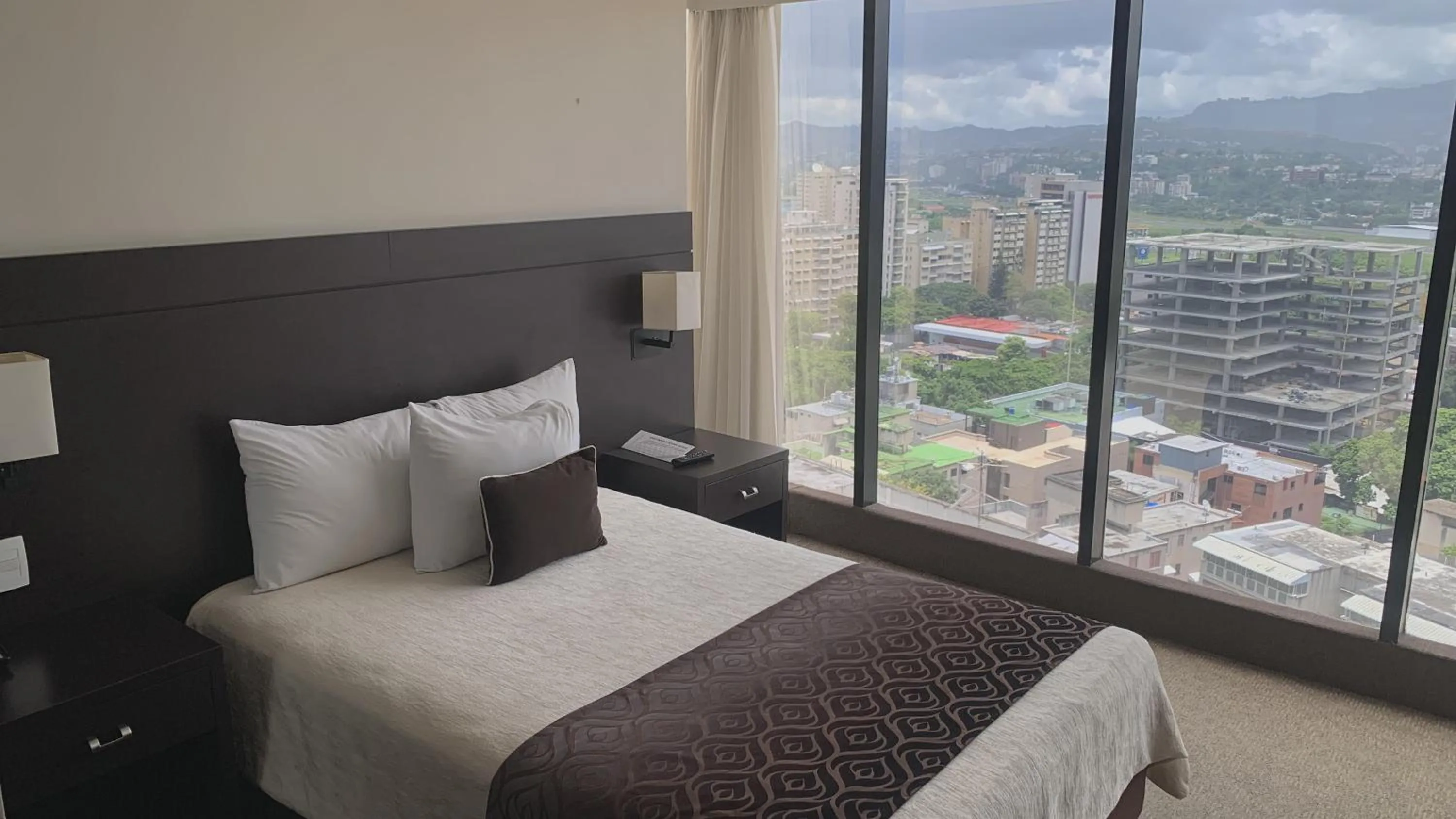 View (from property/room), Bed in HOTEL CHACAO SUITES
