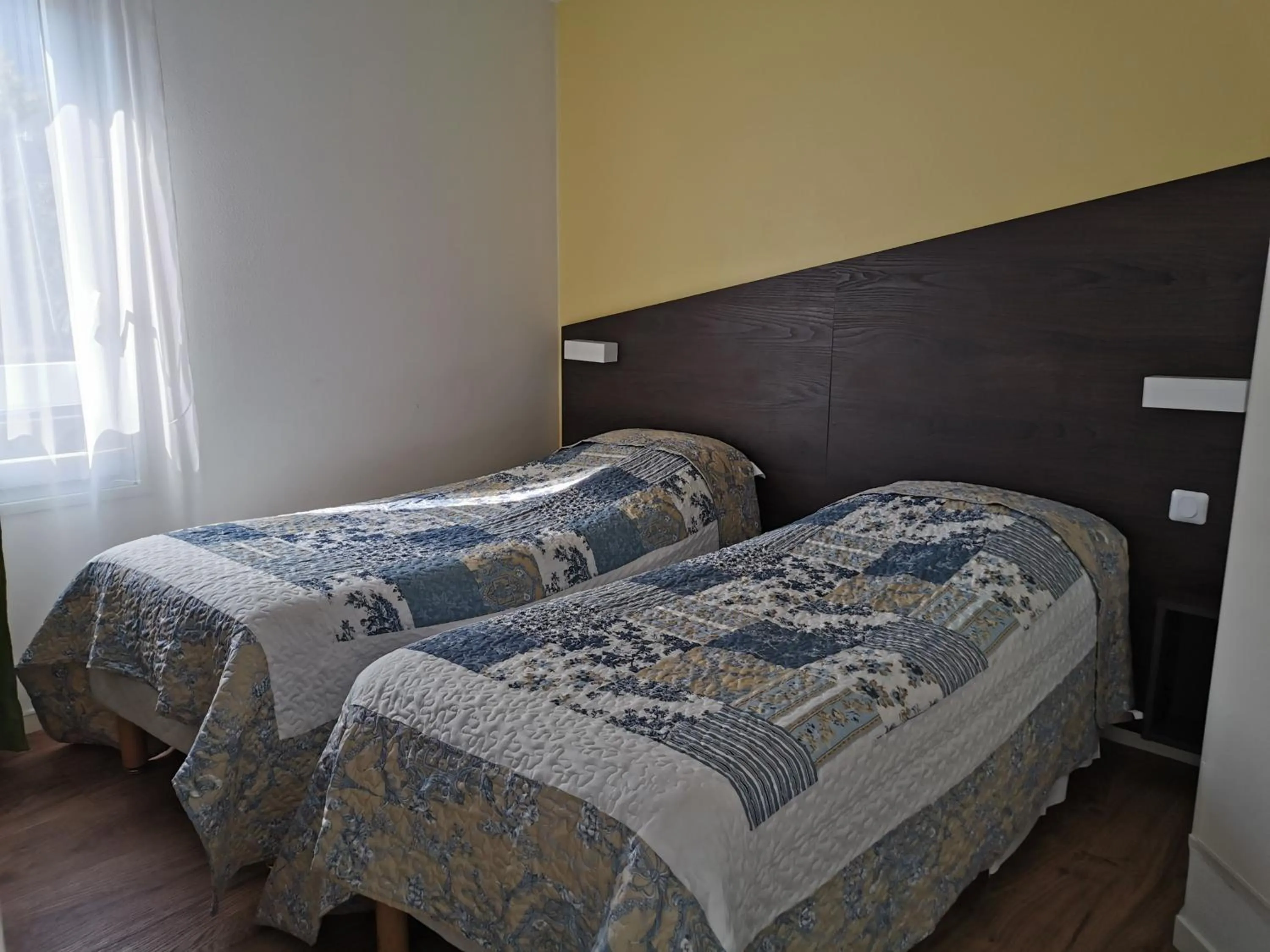 Bed in FASTHOTEL PARIS OUEST BOUAFLE