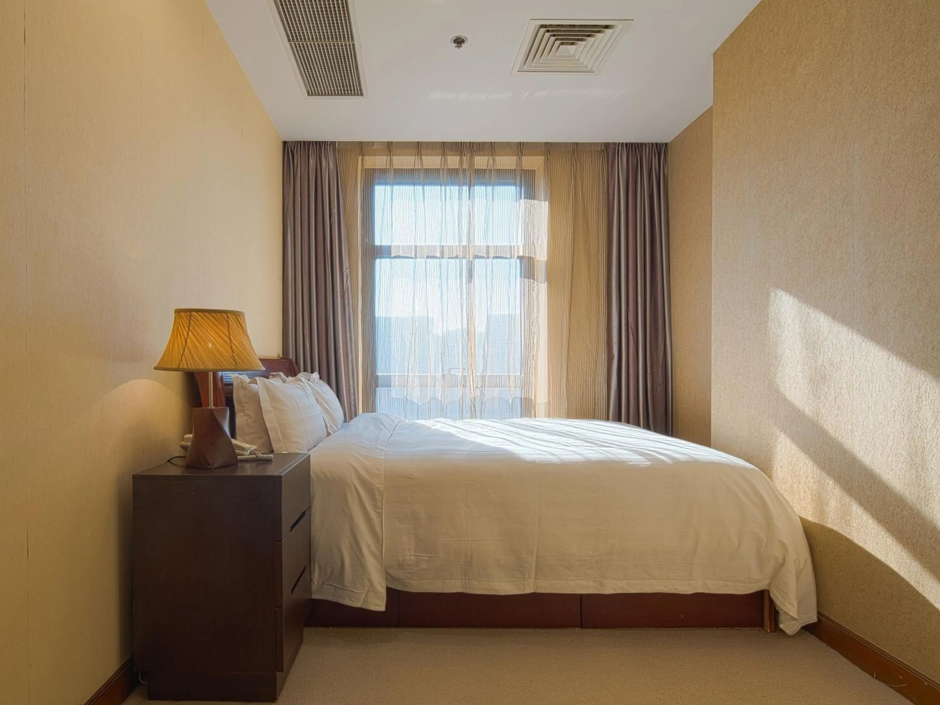 Bed in Dalian Asia Pacific Service Apartment (Former Somerset Harbour Court Dalian)