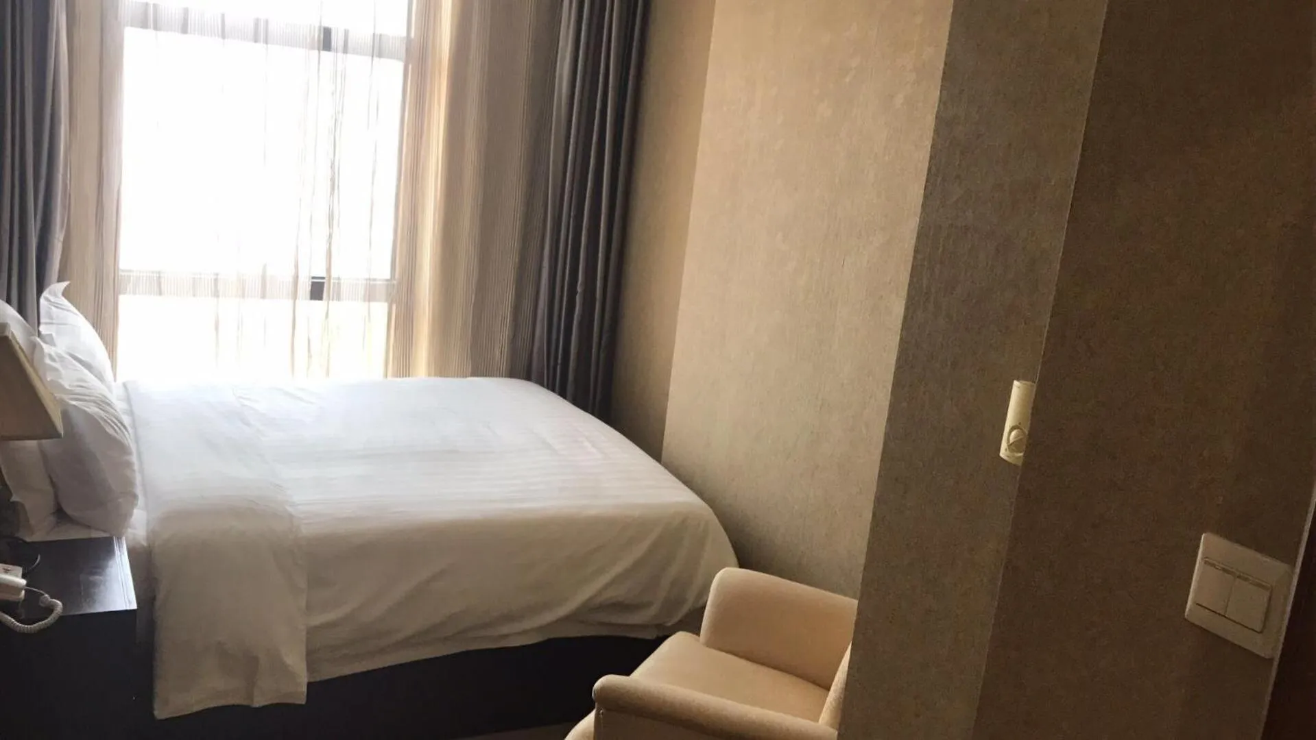Bed in Dalian Asia Pacific Service Apartment (Former Somerset Harbour Court Dalian)