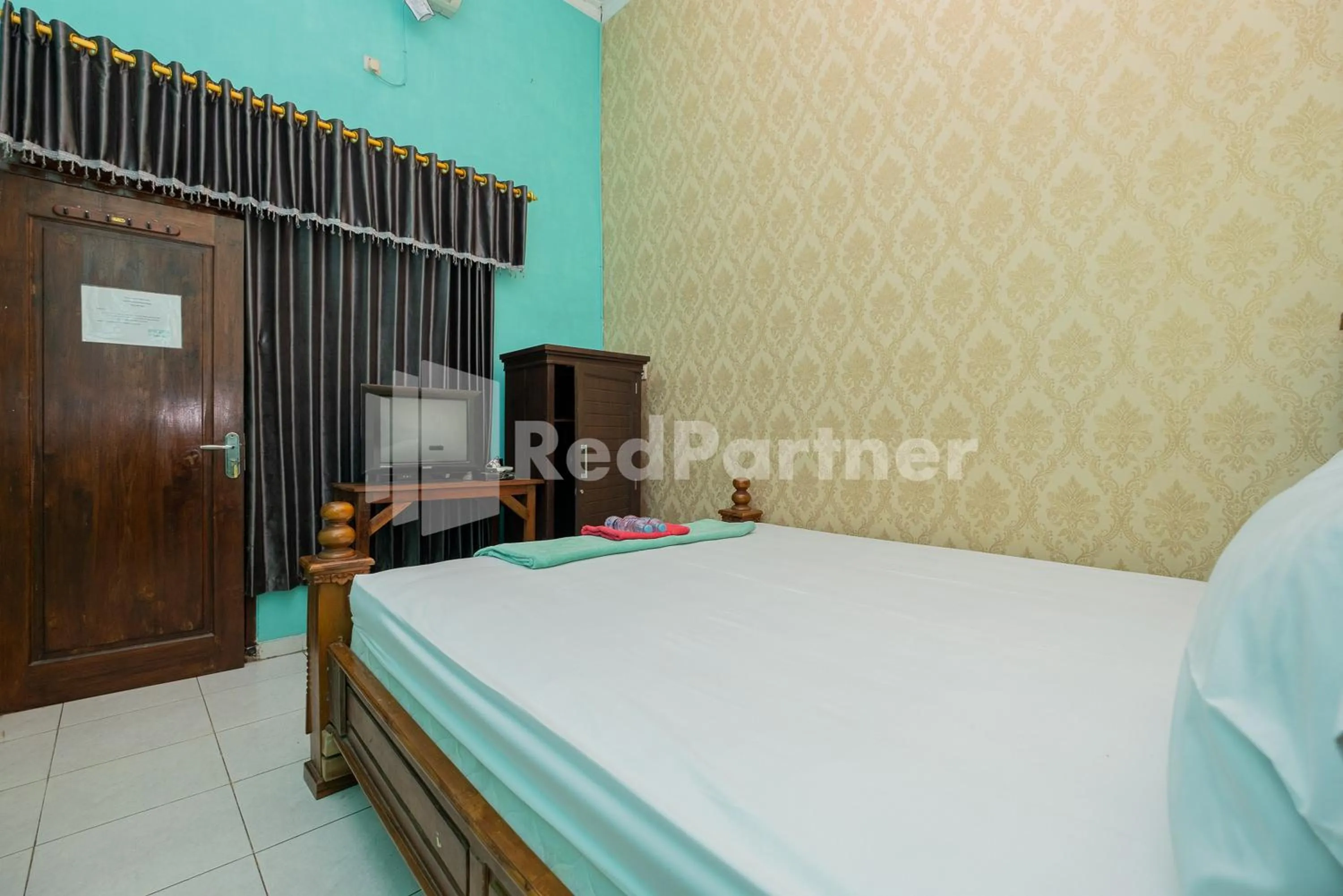 Bed in Hotel Wisata Ziarah Sunan Bonang Syariah Mitra RedDoorz
