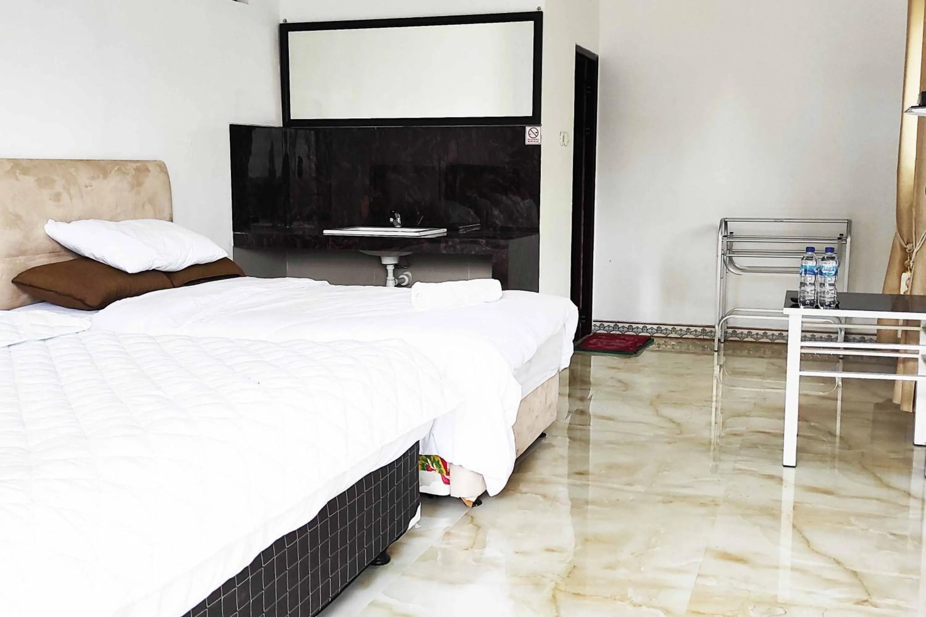 Bed in Pertiwi Homestay Near Museum Angkut Batu Mitra RedDoorz