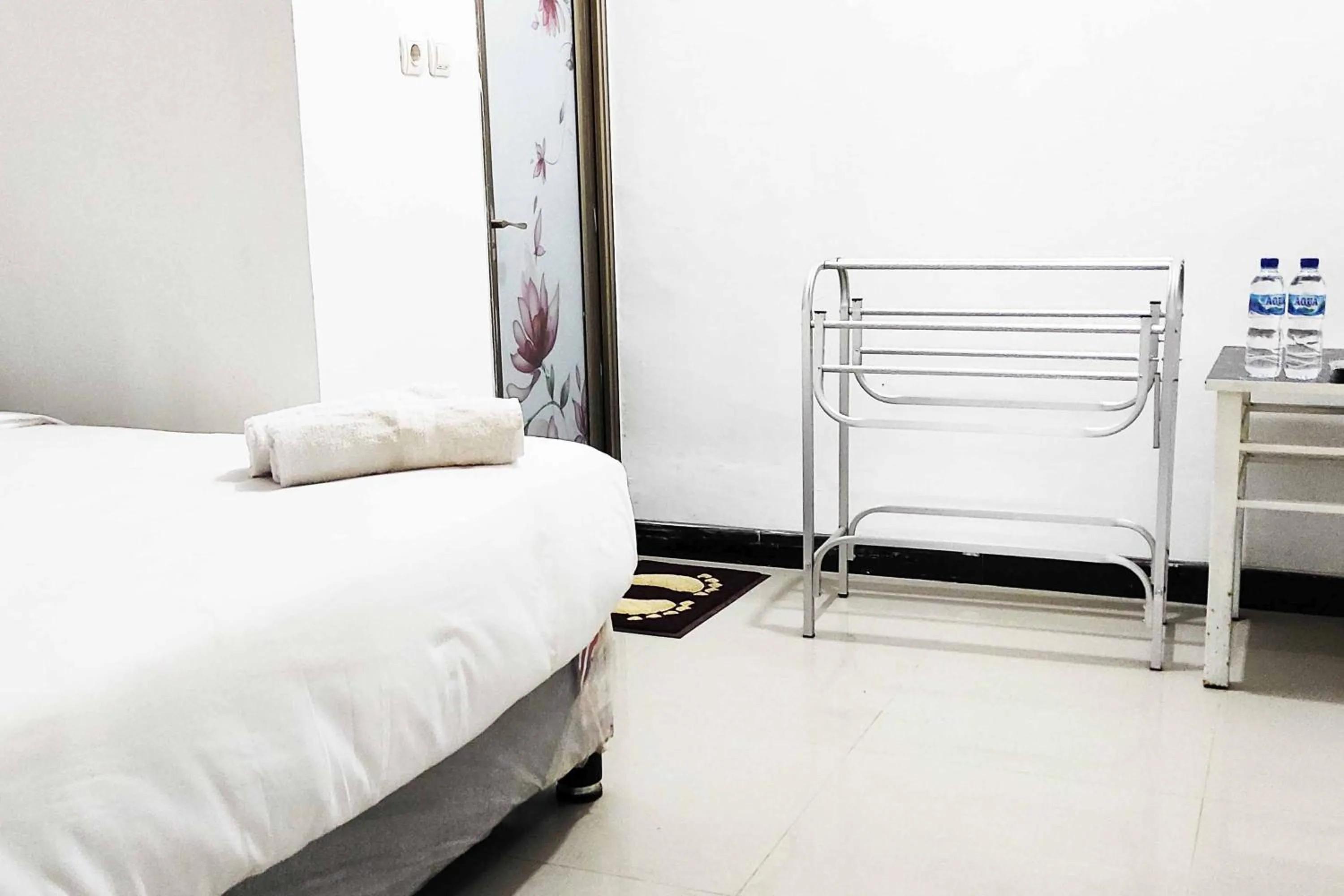 Bed in Pertiwi Homestay Near Museum Angkut Batu Mitra RedDoorz